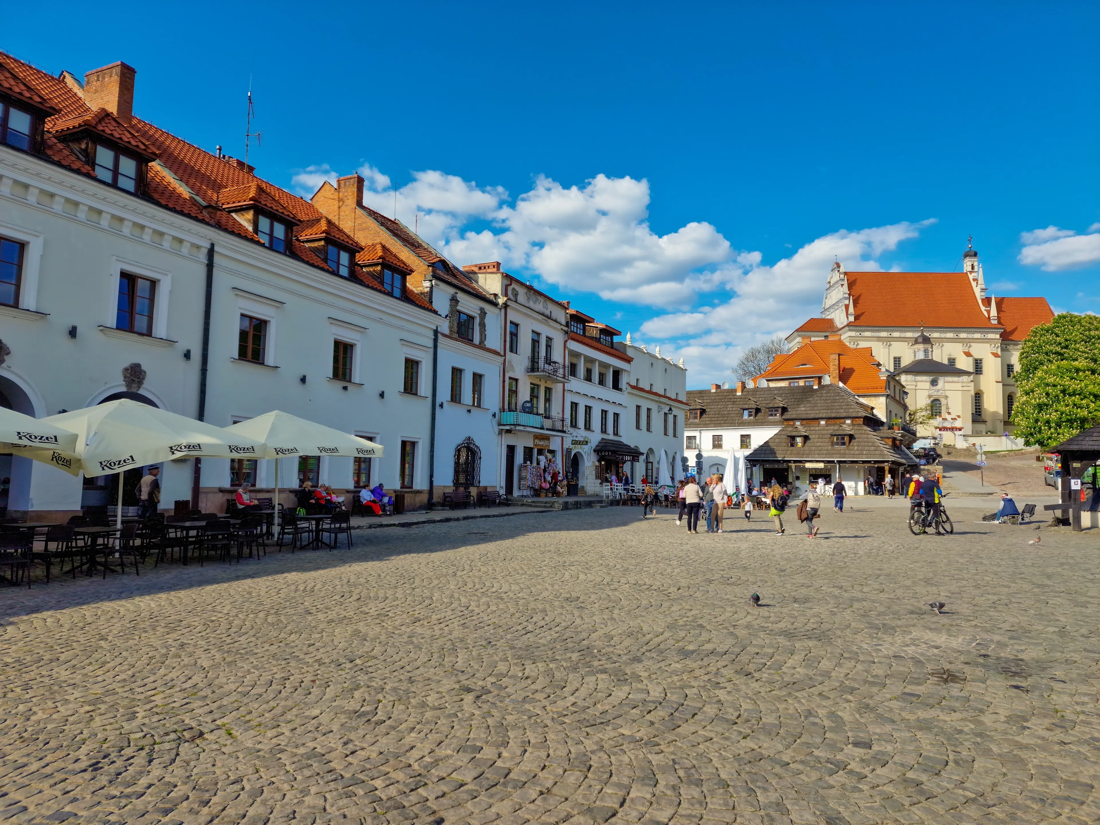 Kazimierz Dolny, Poland May 10, 2023: market square with church in old town Kazimierz Dolny, Poland