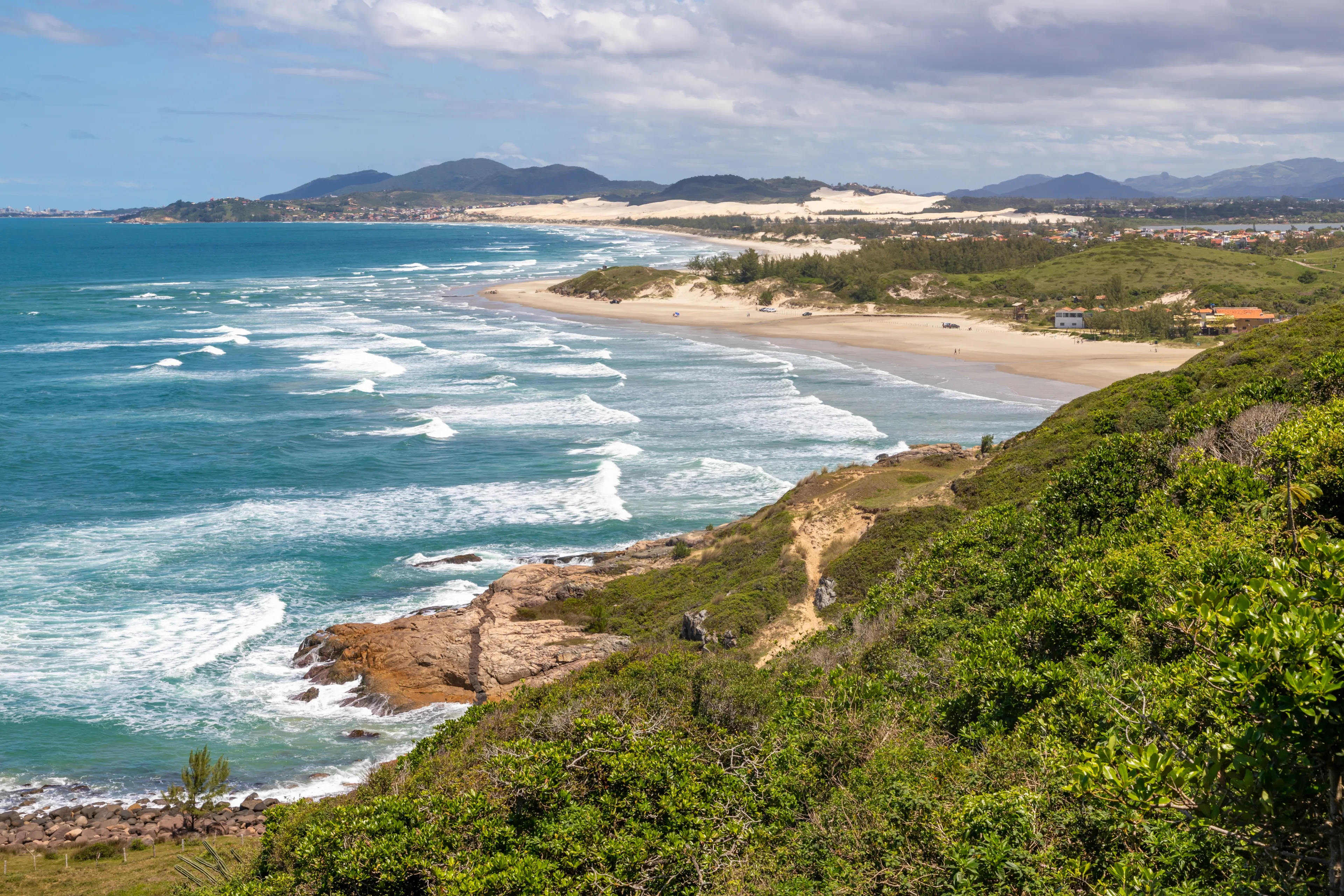 Trail to the beach with vegetation, rocks and mountain, Barra do Ibiraquera , Ibiraquera, Santa Catarina, Brazil
