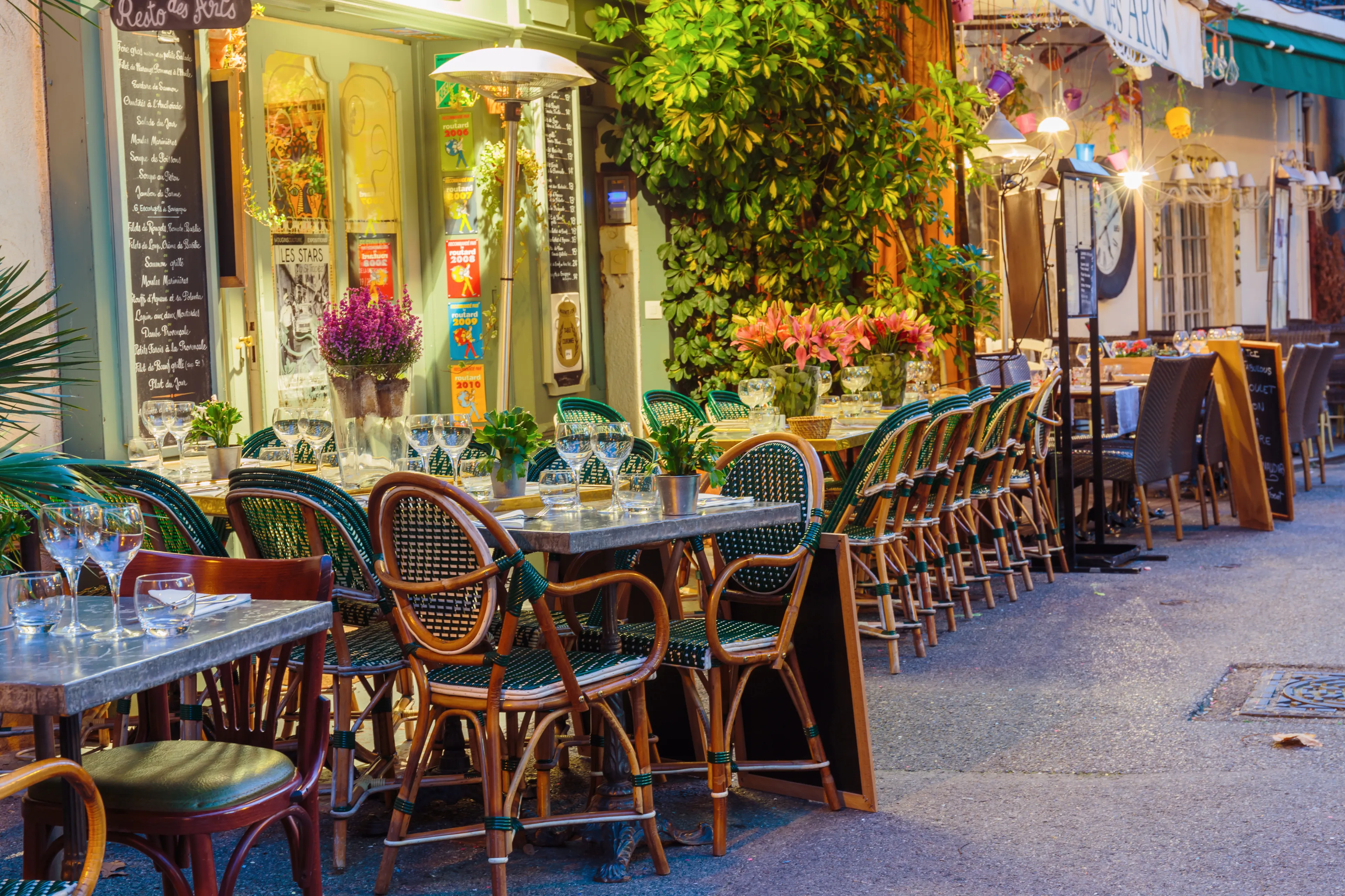 MOUGINS, FRANCE - OCTOBER 31, 2014: Street cafe at night