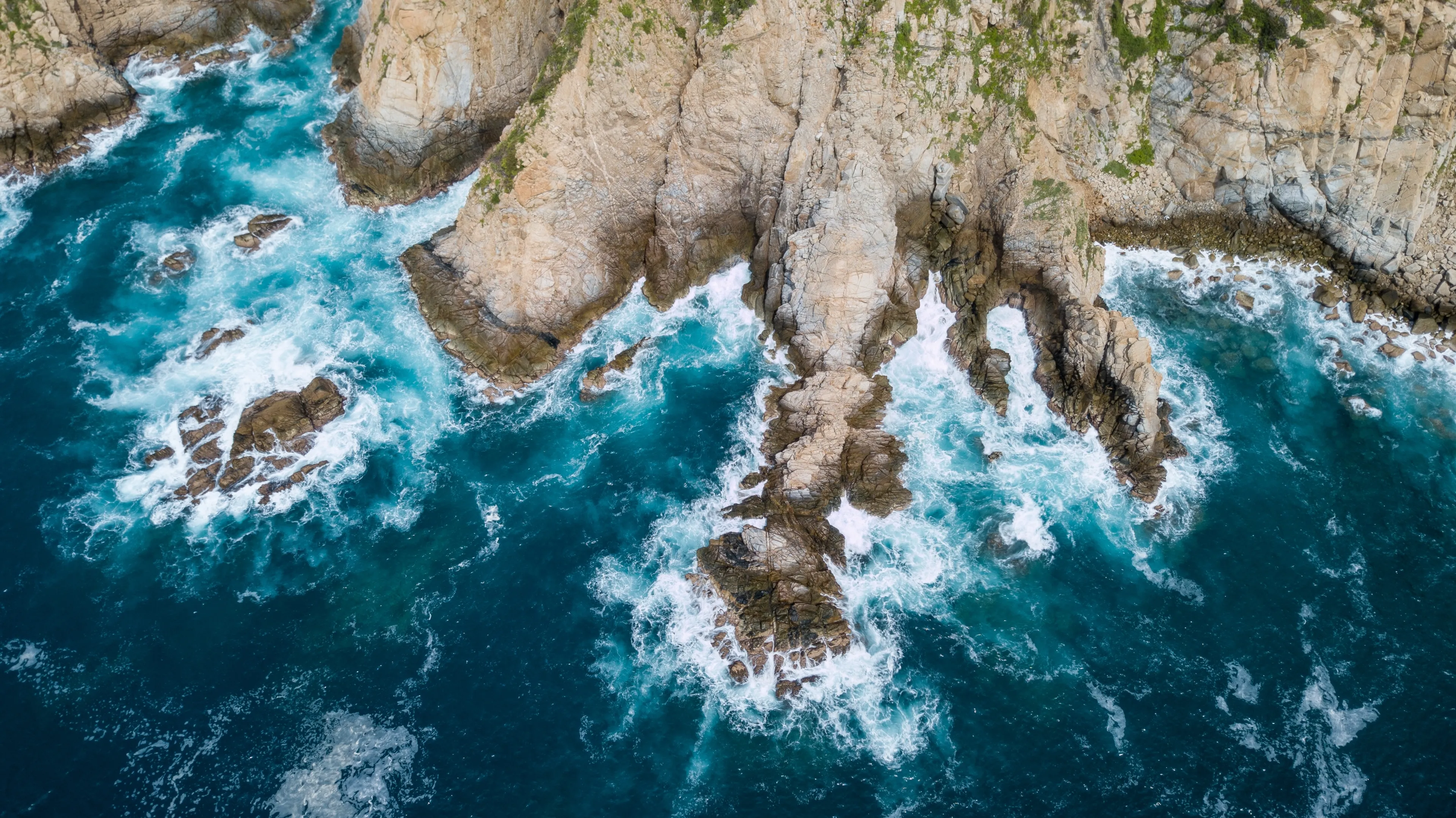 Aerial view of Santa Cruz Huatulco Bay on a sunny day in Oaxaca, Mexico
