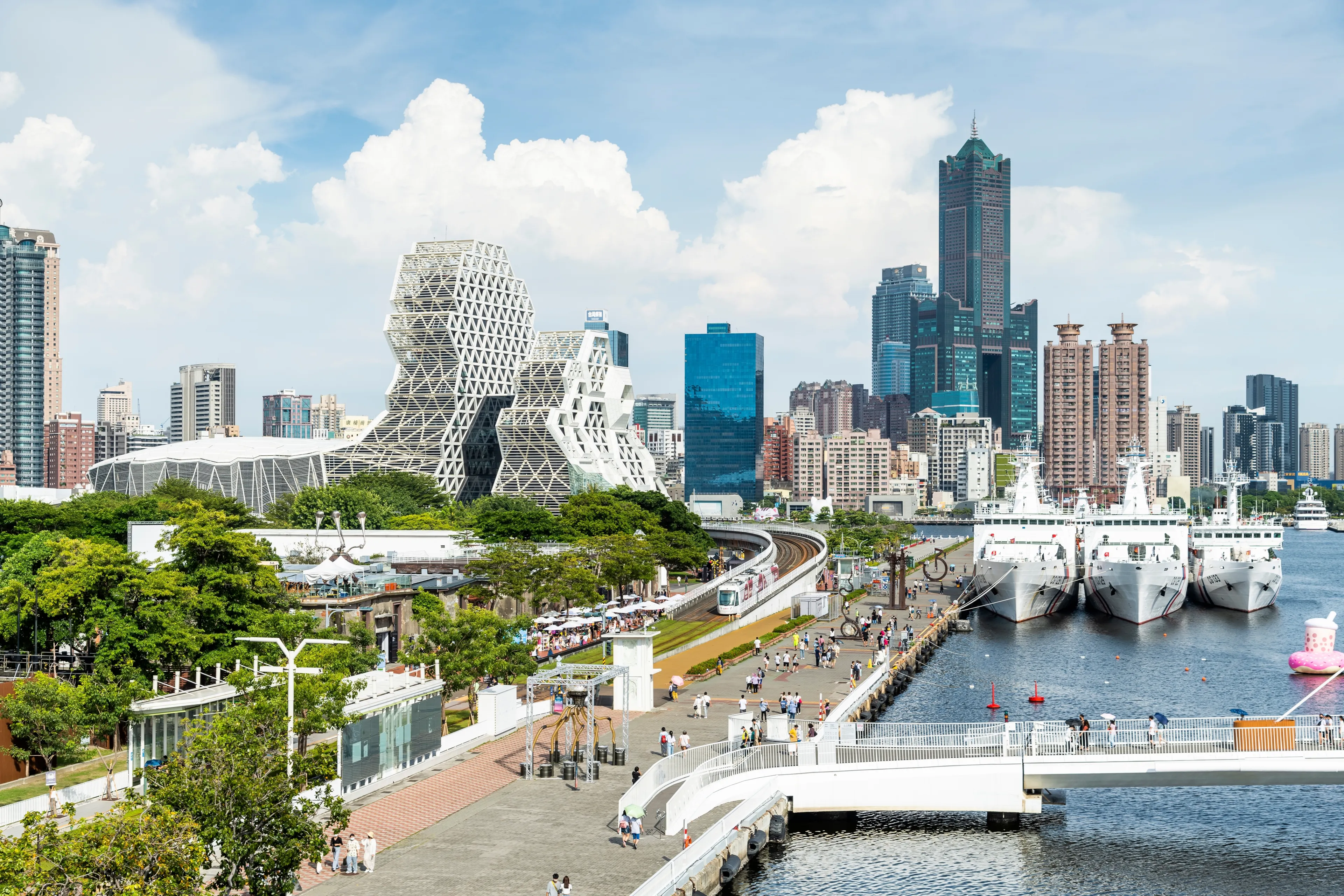 Kaohsiung, Taiwan- August 27, 2022: Overlooking view of the Pier-2 Art Center with the famous landmark 85 Sky Tower and Kaohsiung Music Center in the port of Kaohsiung, Taiwan.