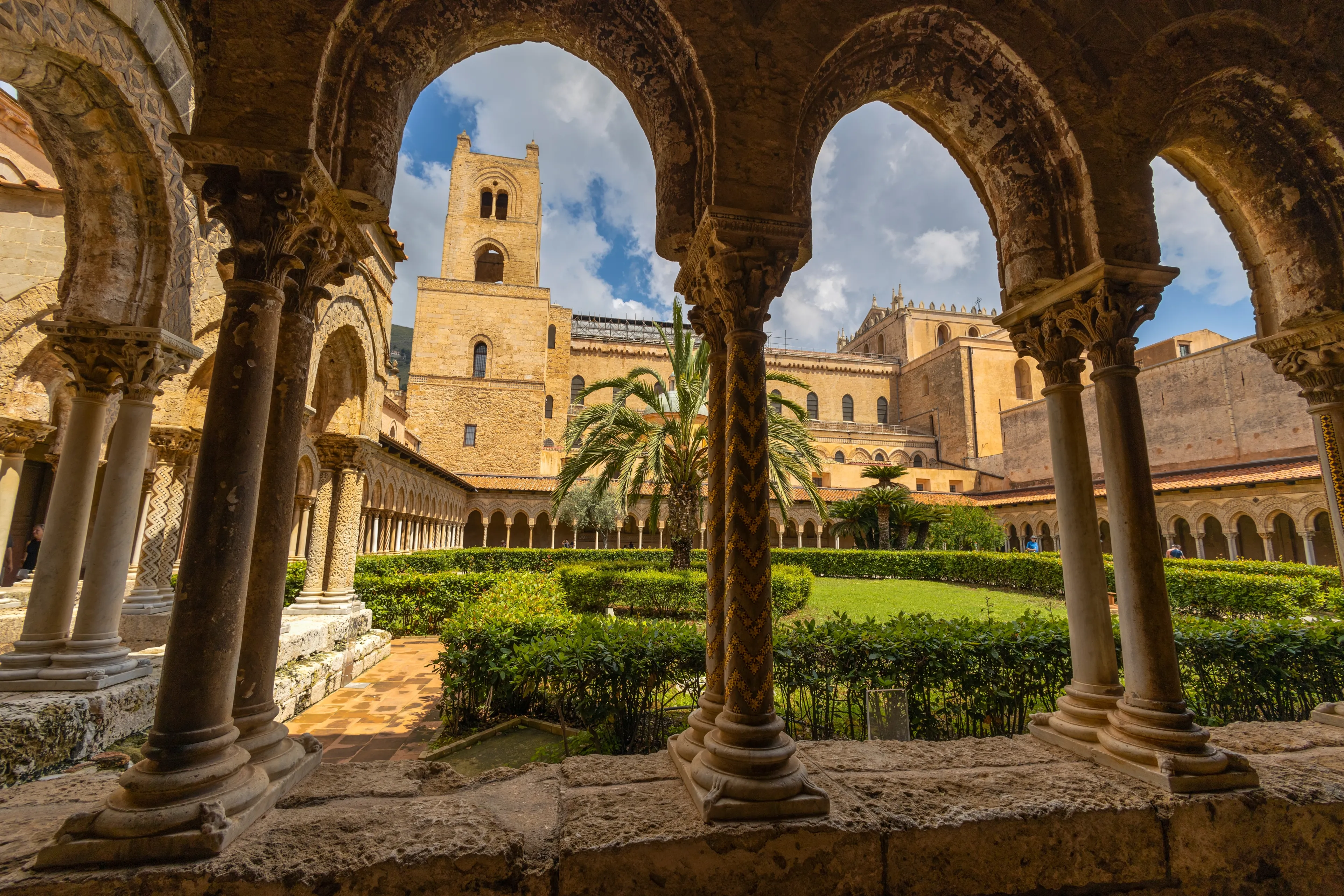 MONREALE, ITALY 16 JUNE, 2023 - Benedictine Cloister and Monreale Cathedral in Monreale, province of Palermo, Sicily, Italy