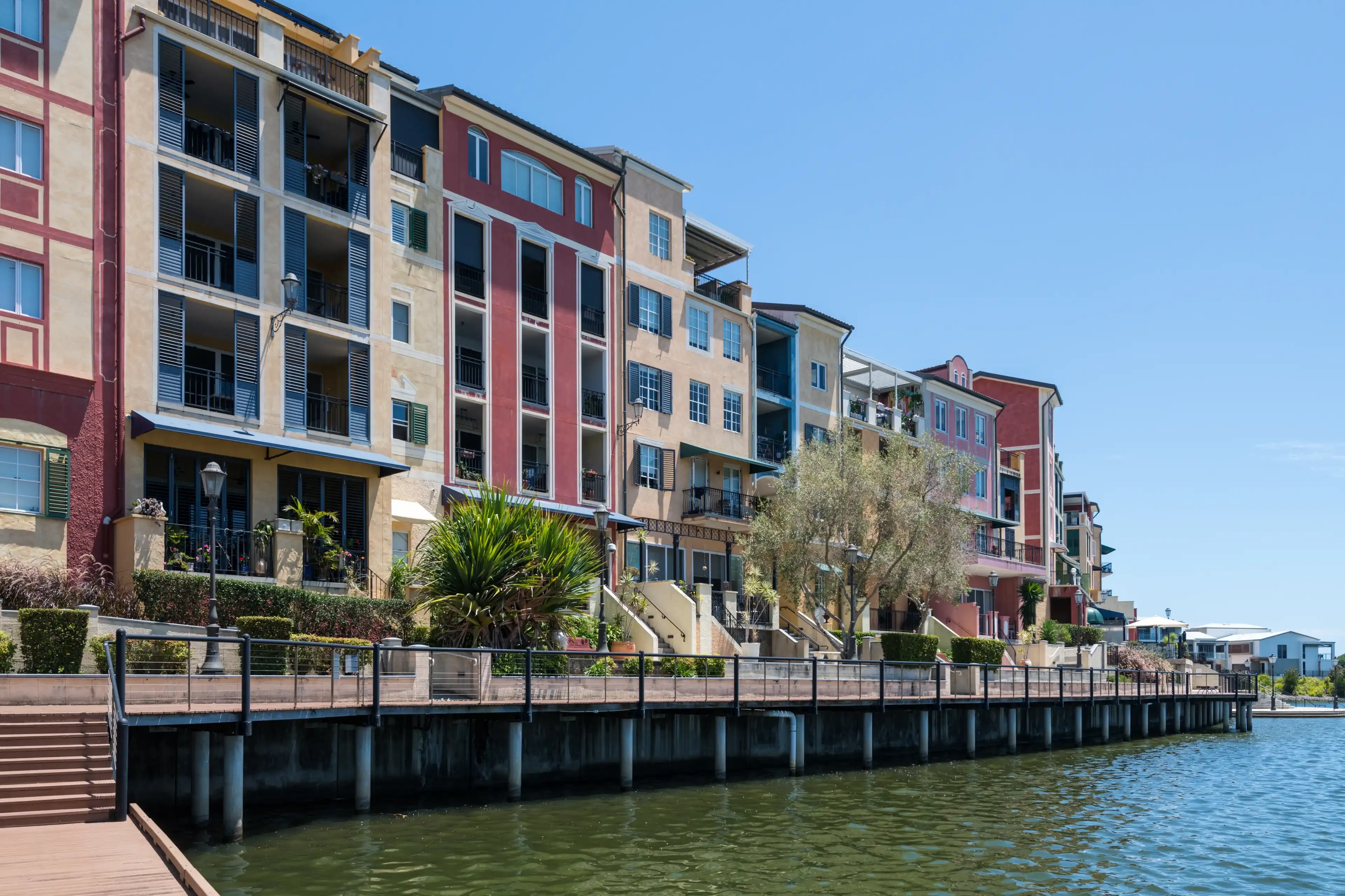 Gold Coast, Queensland Australia – January 9 2023: Colourful architectural apartments Emerald Lakes Carrara Gold Coast, Queensland Australia – January 9 2023: Colourful architectural apartments Emerald Lakes Carrara