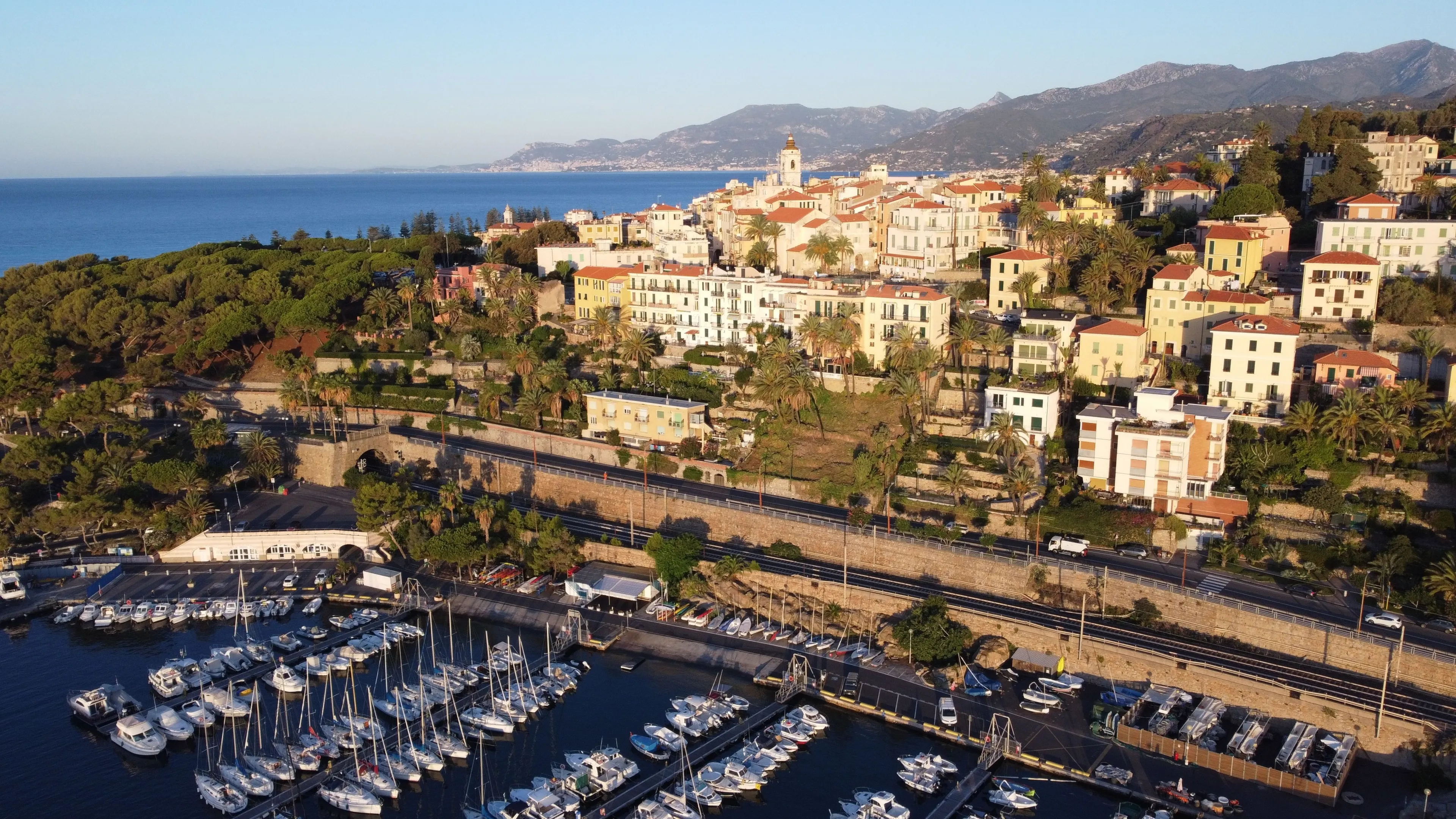 A drone shot of boats near the docks of the harbor next to Bordighera, Italy