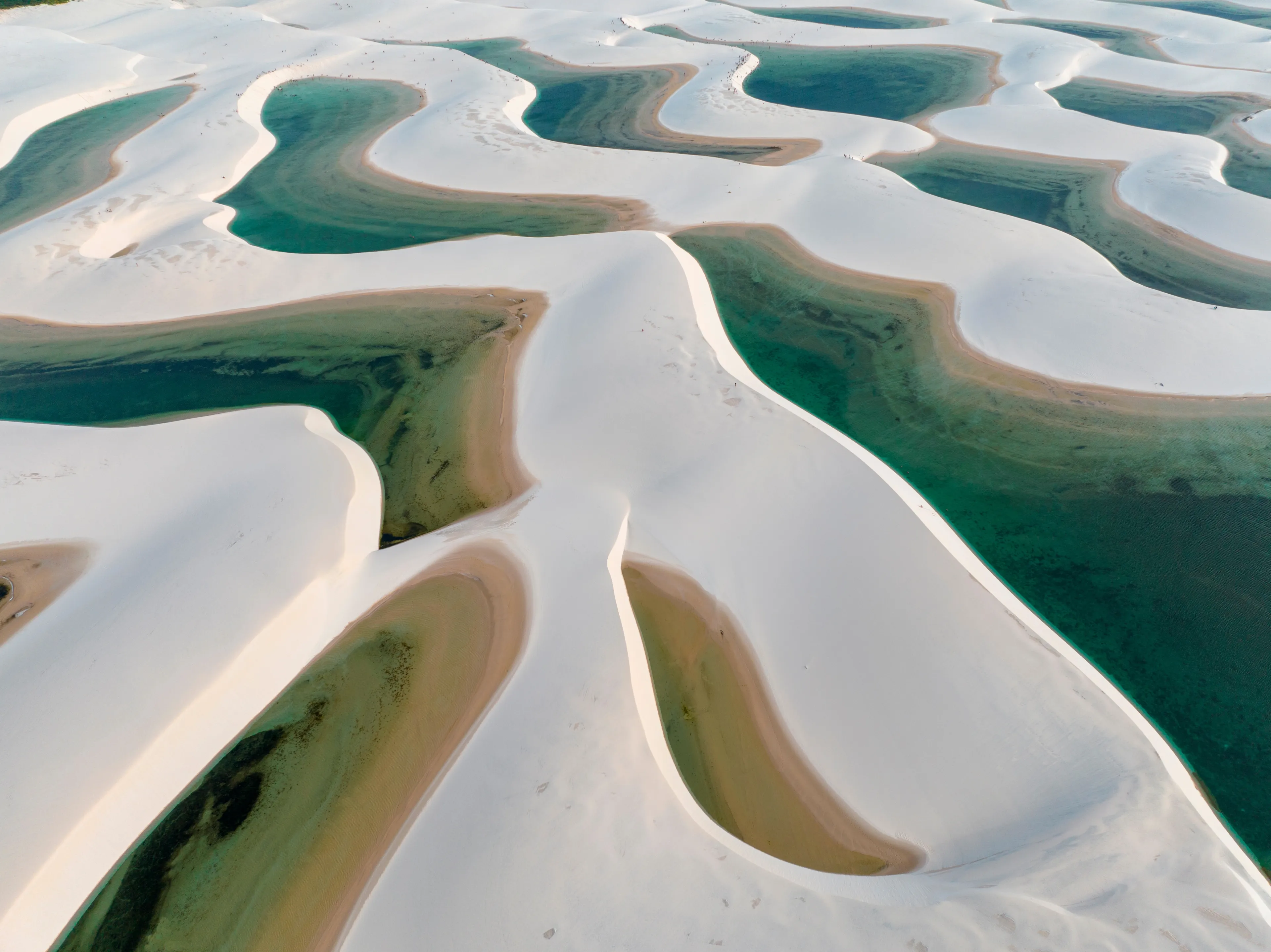 Aerial view of Lencois Maranhenses. White sand dunes with pools of fresh and transparent water. Desert. Barreirinhas. Maranhao State National Park. Brazil
