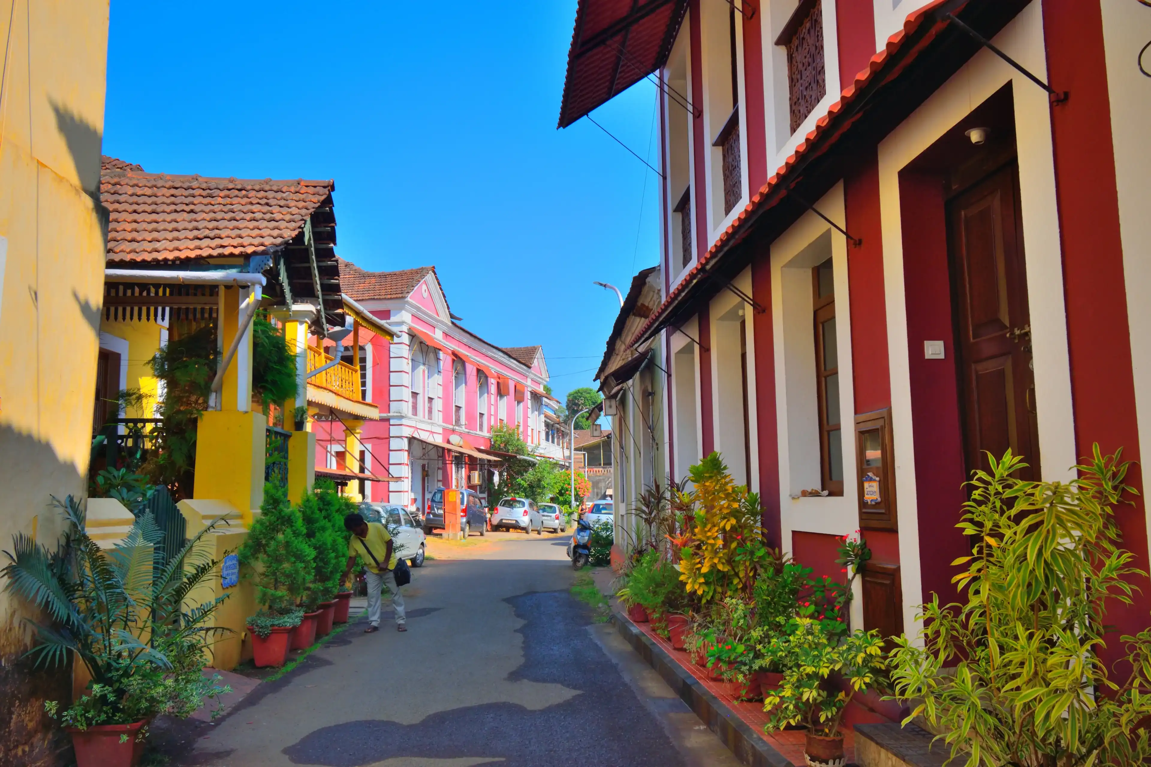 Panaji, India - January 23, 2019: A narrow lane surrounded by colorful portuguese houses in Panjim, Goa. Panaji, India - January 23, 2019: A narrow lane surrounded by colorful portuguese houses in Panjim, Goa.
