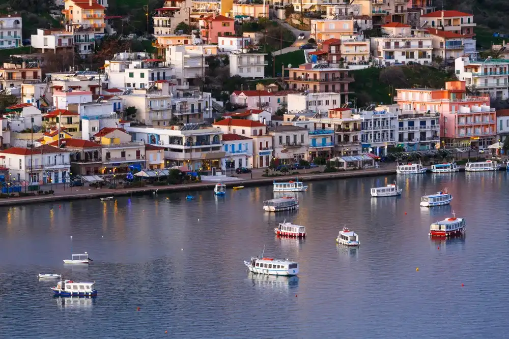 Galatas, Greece - January 19, 2018: View of Galatas village in Peloponnese peninsula from Poros island, Greece. Galatas, Greece - January 19, 2018: View of Galatas village in Peloponnese peninsula from Poros island, Greece.