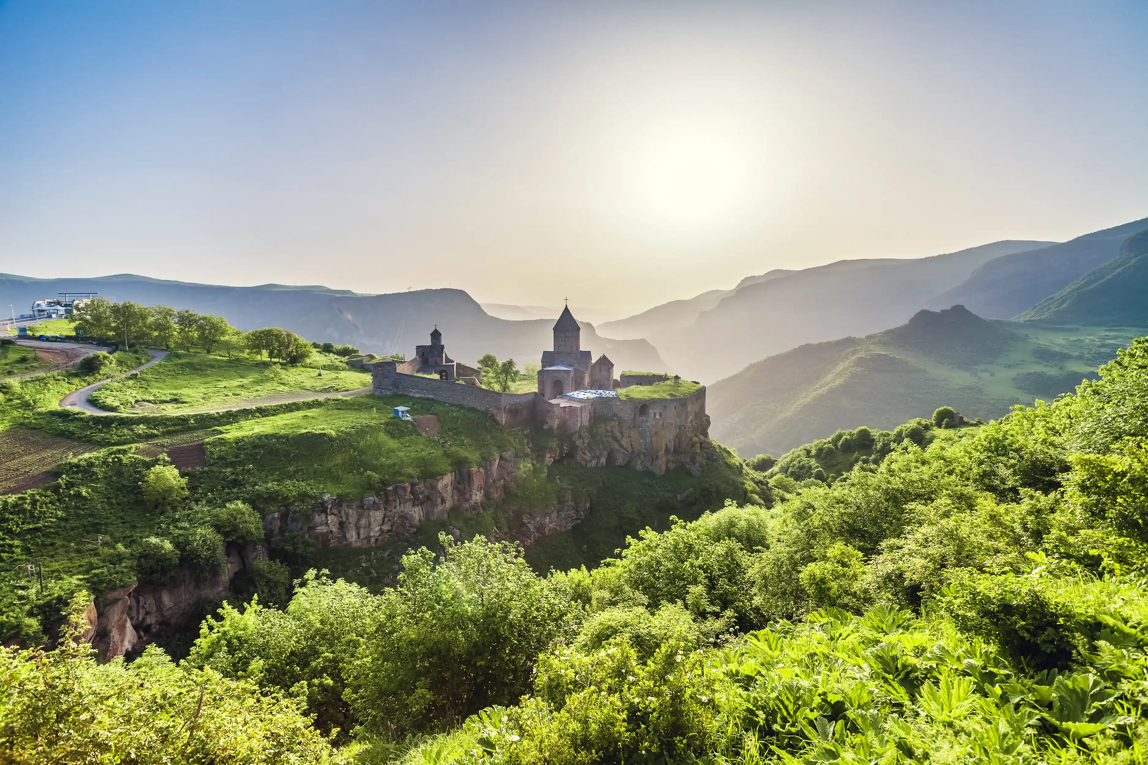 Ancient monastery in setting sun. Tatev. Armenia Ancient monastery in setting sun. Tatev. Armenia