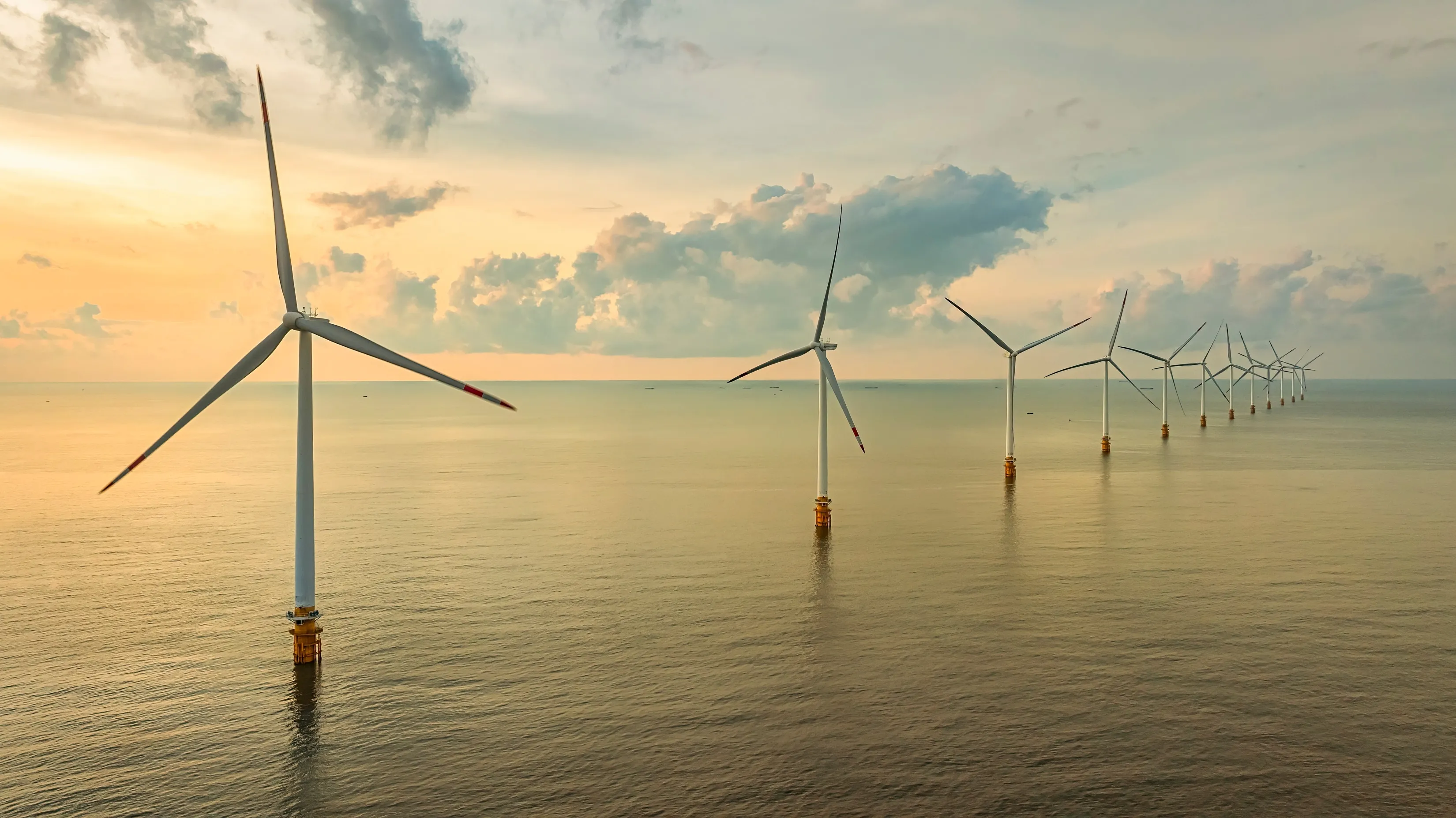 Landscape with Turbine Green Energy Electricity, Windmill for electric power production, Wind turbines generating electricity on ocean at Ba Dong, Tra Vinh, Vietnam. Clean energy concept.