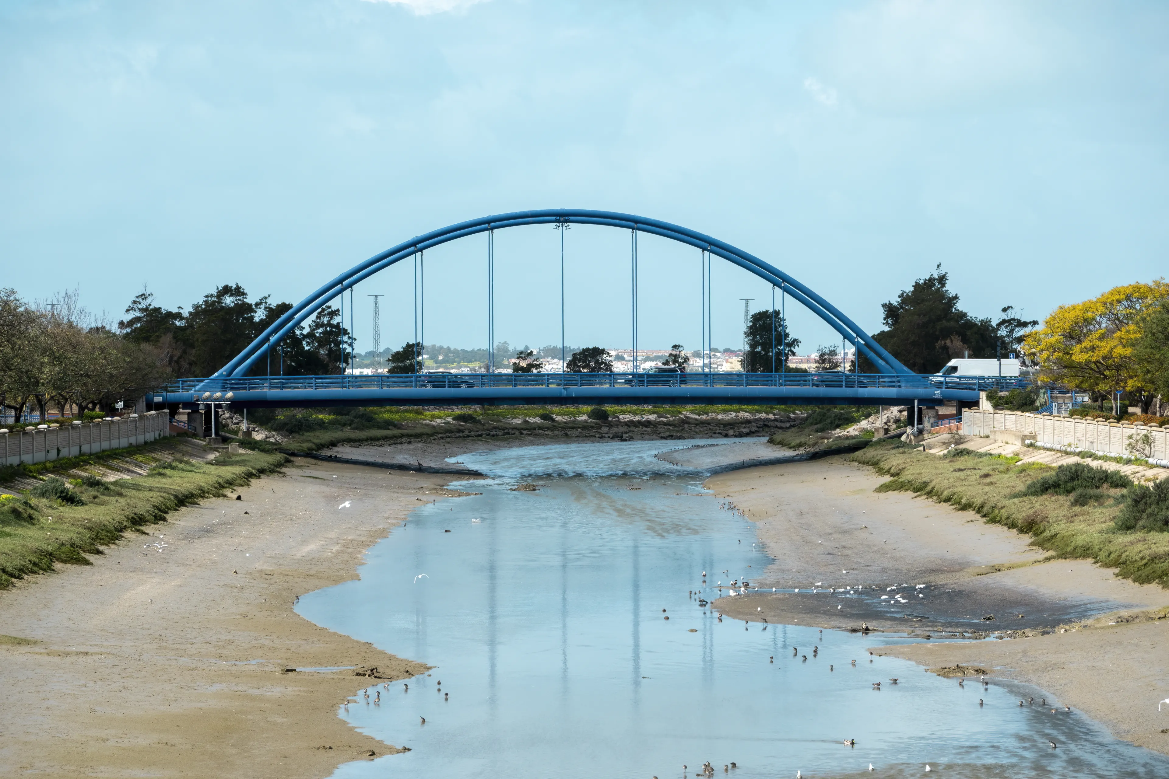 Chiclana de la Frontera, Cadiz, Spain - February 26, 2024: View of the Customs building in Cadiz, Spain.Landscape with the so-called Blue Bridge over the Iro river with little water in Chiclana de la 