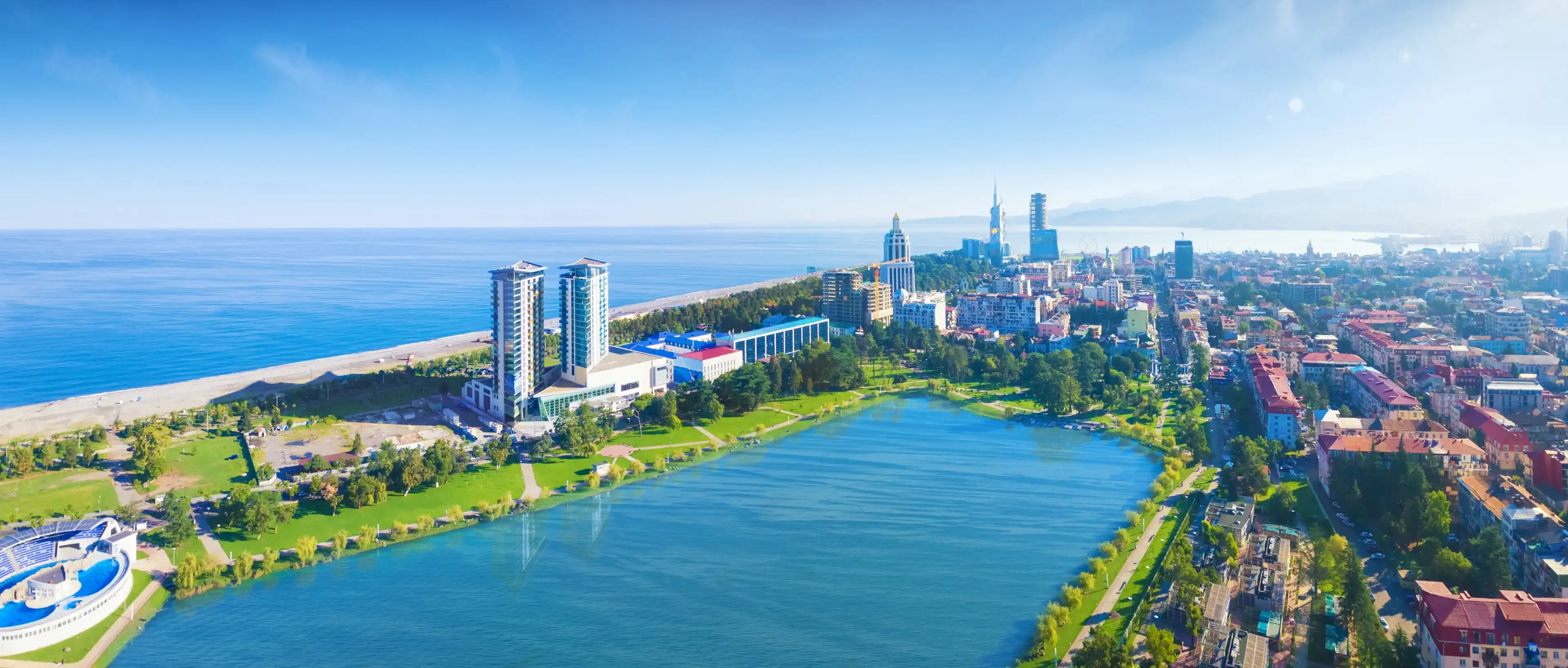 Aerial panoramic image of beautiful Batumi made with drone in sunny summer weather. Batumi is capital of Autonomous Republic of Adjara in Georgia, located on coast of Black Sea. Aerial panoramic image of beautiful Batumi made with drone in sunny summer weather. Batumi is capital of Autonomous Republic of Adjara in Georgia, located on coast of Black Sea.