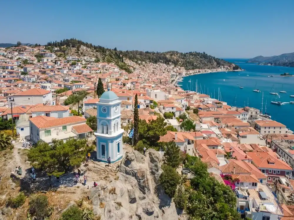 Aerial view Poros island by drone. Summer Greece. Beach. Mediterranean sea. Aerial view Poros island by drone. Summer Greece. Beach. Mediterranean sea.