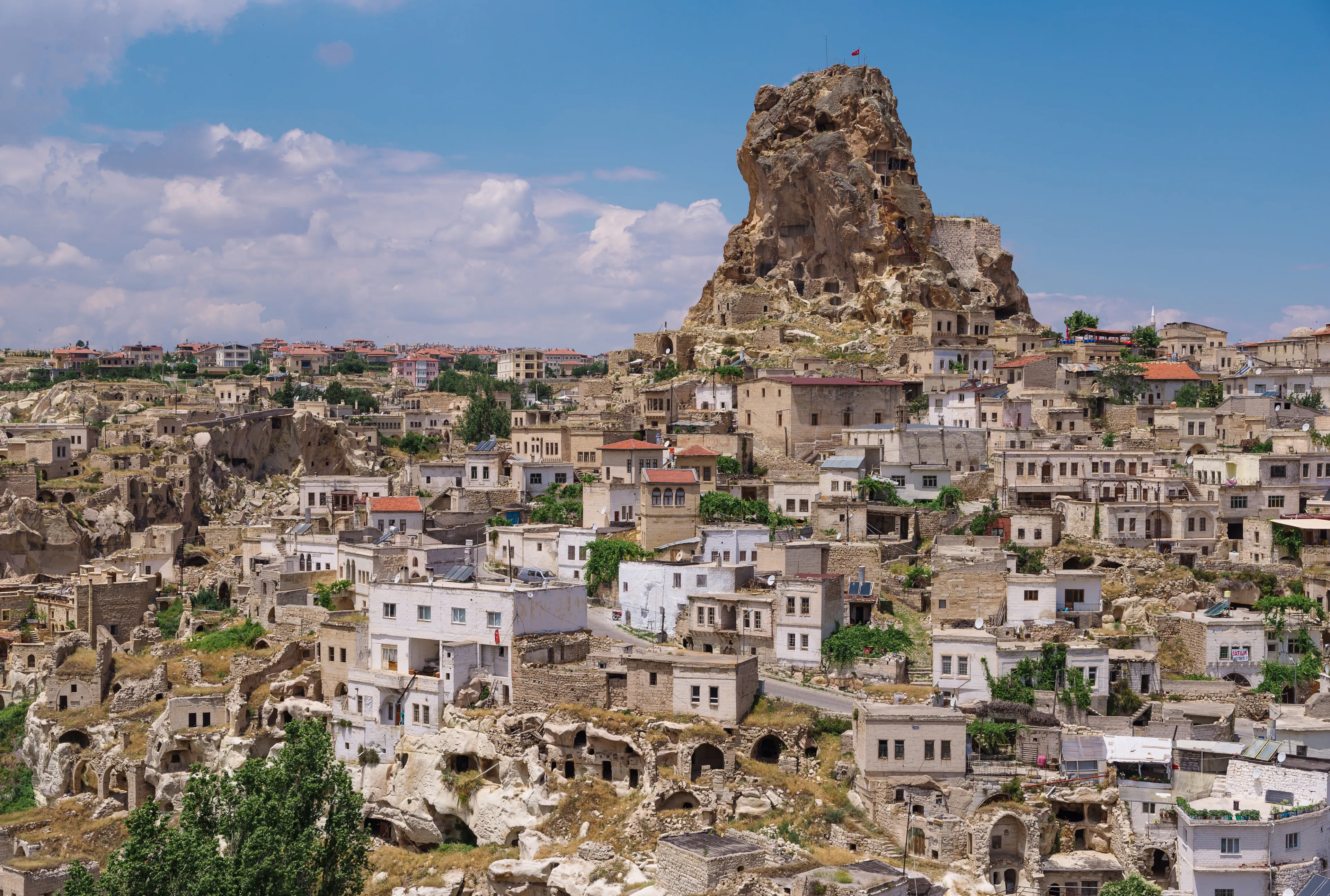 View of Ortahisar town old houses in rock formations from Ortahisar Castle. Cappadocia. Nevsehir Province. Turkey