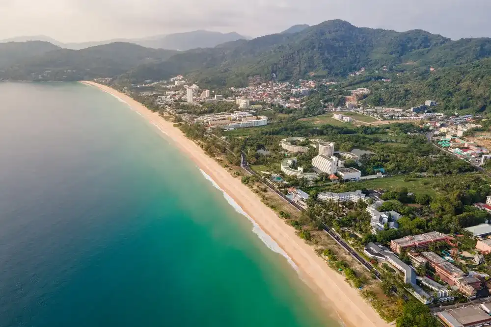 Aerial view of Karon Beach in Phuket. Beautiful scenery beach of Andaman sea. Famous tourist destination in Thailand Aerial view of Karon Beach in Phuket. Beautiful scenery beach of Andaman sea. Famous tourist destination in Thailand