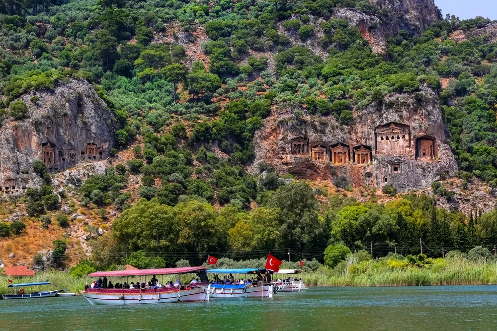 Mugla-Turkey 05 June 2019: You can enjoy the magnificent view of the Kaunos Rock Tombs in Dalyan Ortaca and experience the Köycegiz River and nature through boat tours.