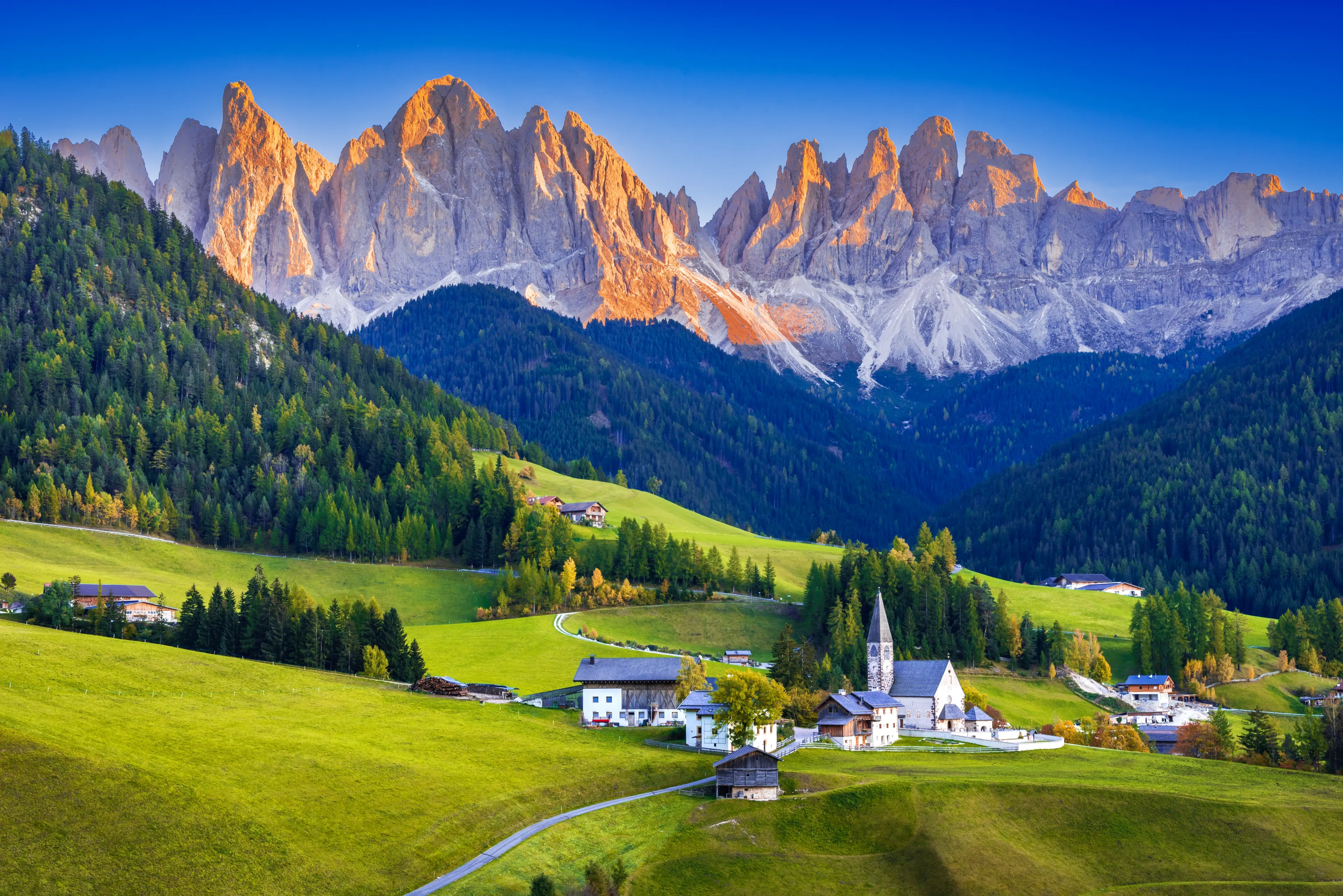 Val di Funes, Italy - Sunset Odle Ridge idyllic Dolomites mountains in  South Tyrol, Italian Alps at autumn colors