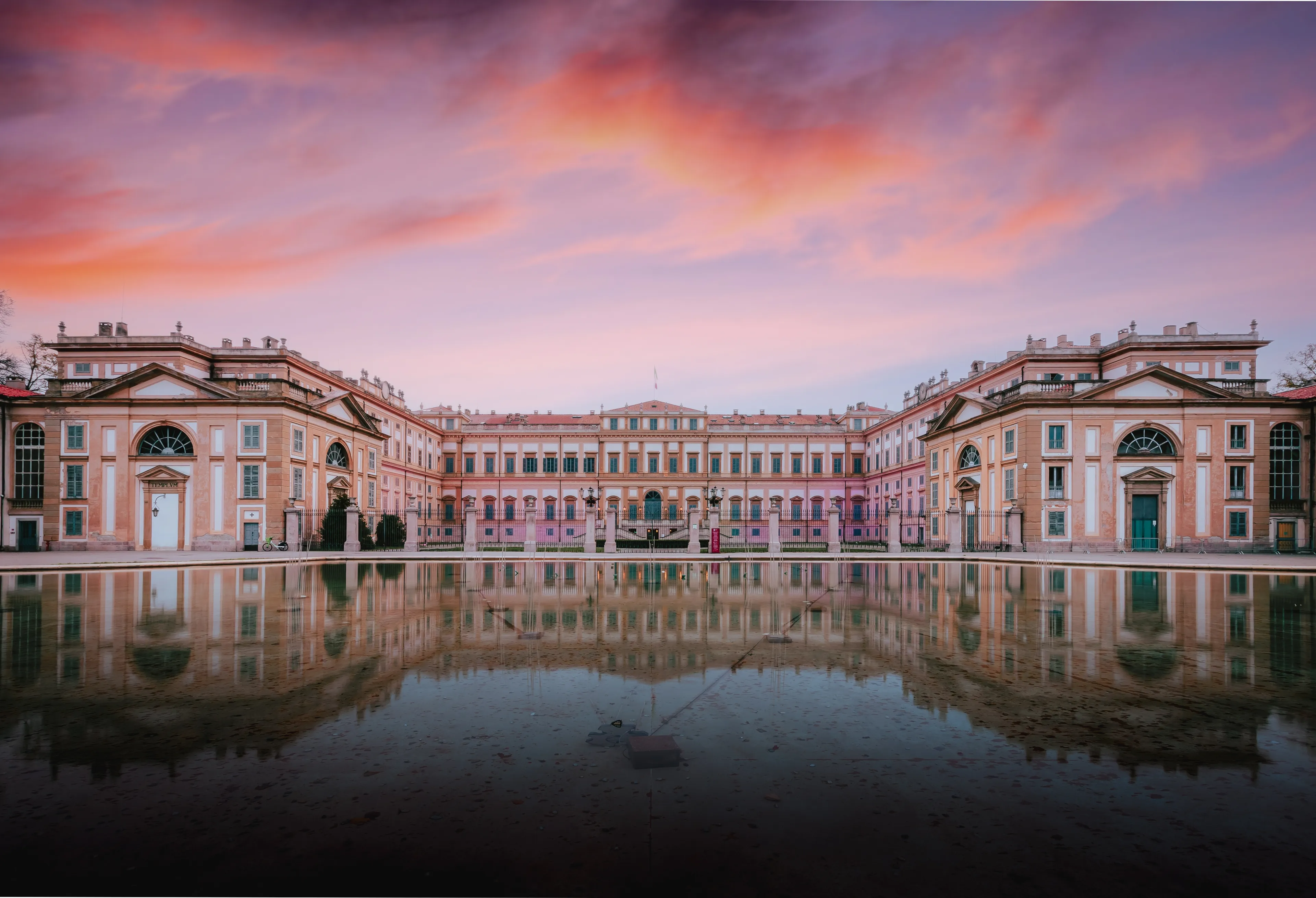 Monza, Italy - November 12, 2023: Villa Reale in Monza in neoclassical style at sunrise with reflection on water