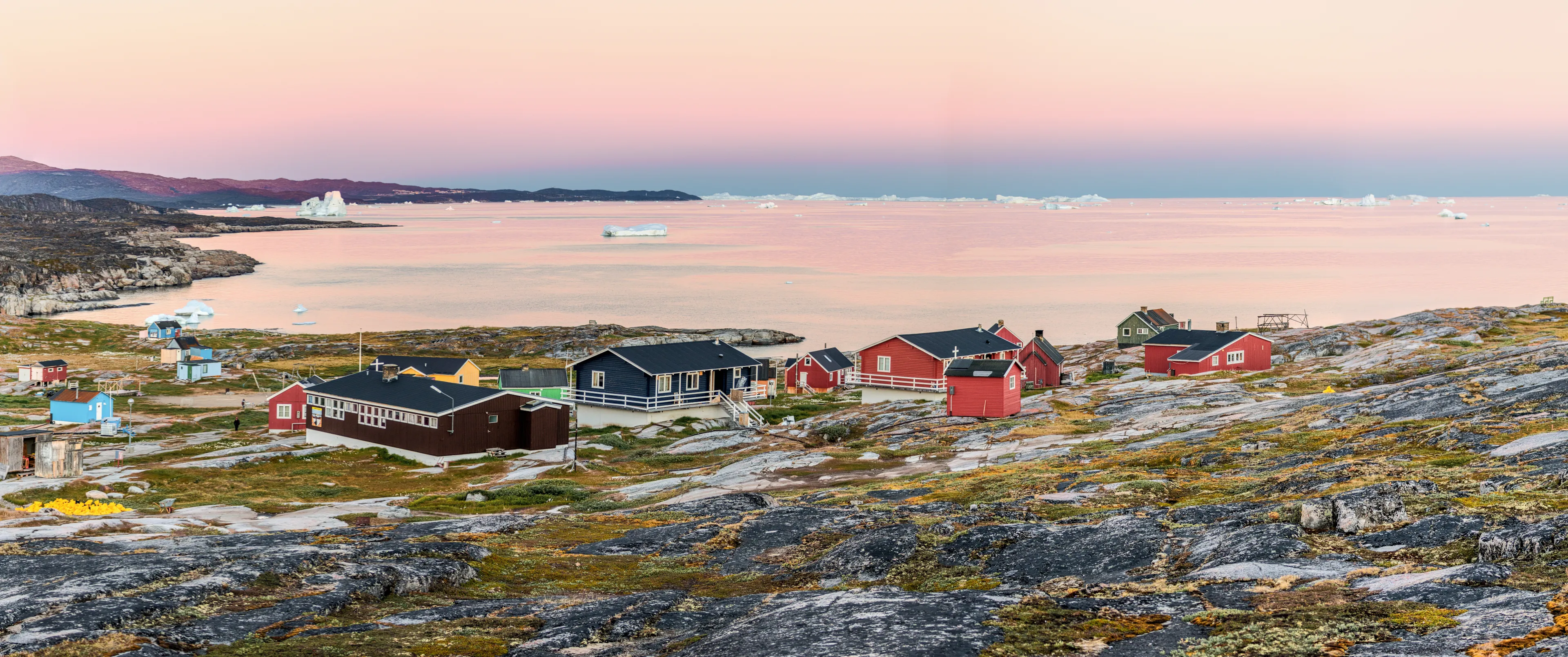 West Greenland. Panorama of Disko Bay with icebergs near Oqaatsut village. Source of icebergs is by the Jakobshavn glacier. This is a consequence of global warming and catastrophic thawing of ice