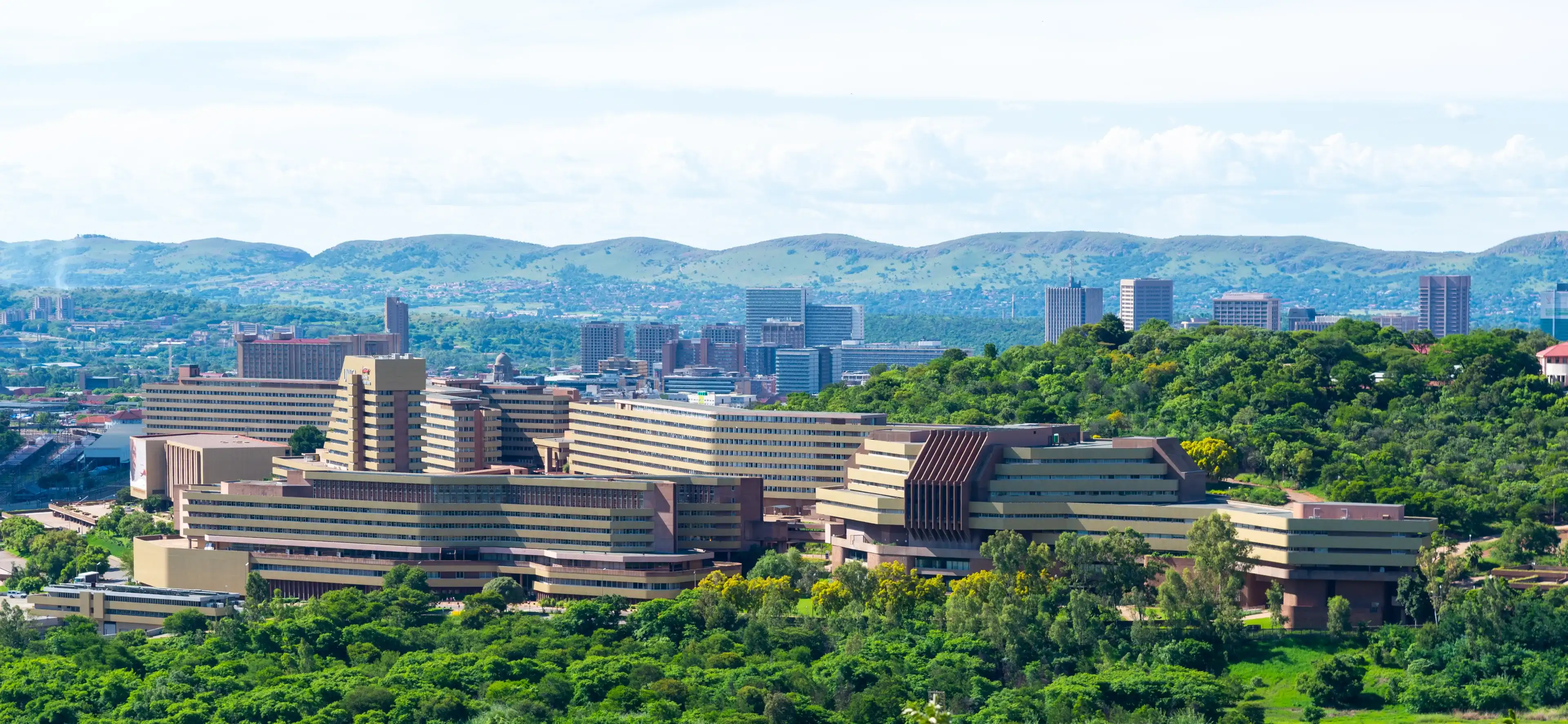 Pretoria, Gauteng, South Africa - Dec. 20 2020: The University of South Africa between the green trees of a rainy season summer. A world class distance learning facility. Pretoria, Gauteng, South Africa - Dec. 20 2020: The University of South Africa between the green trees of a rainy season summer. A world class distance learning facility.