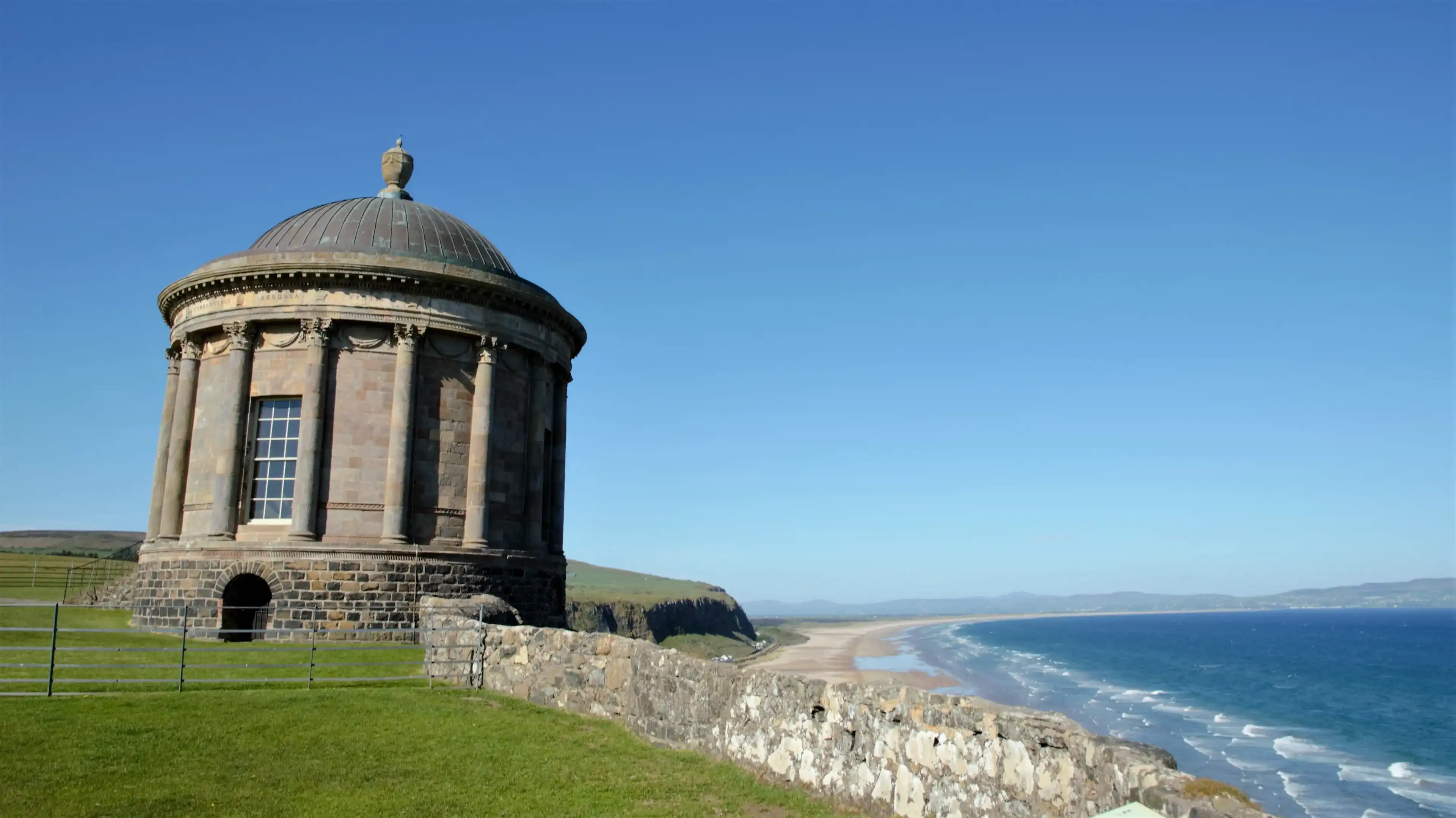 Mussenden Temple is located at a cliff overlooking Downhill Strand in the beautiful surroundings of Downhill Demesne near Castlerock in County Londonderry, Northern Ireland, UK Mussenden Temple is located at a cliff overlooking Downhill Strand in the beautiful surroundings of Downhill Demesne near Castlerock in County Londonderry, Northern Ireland, UK