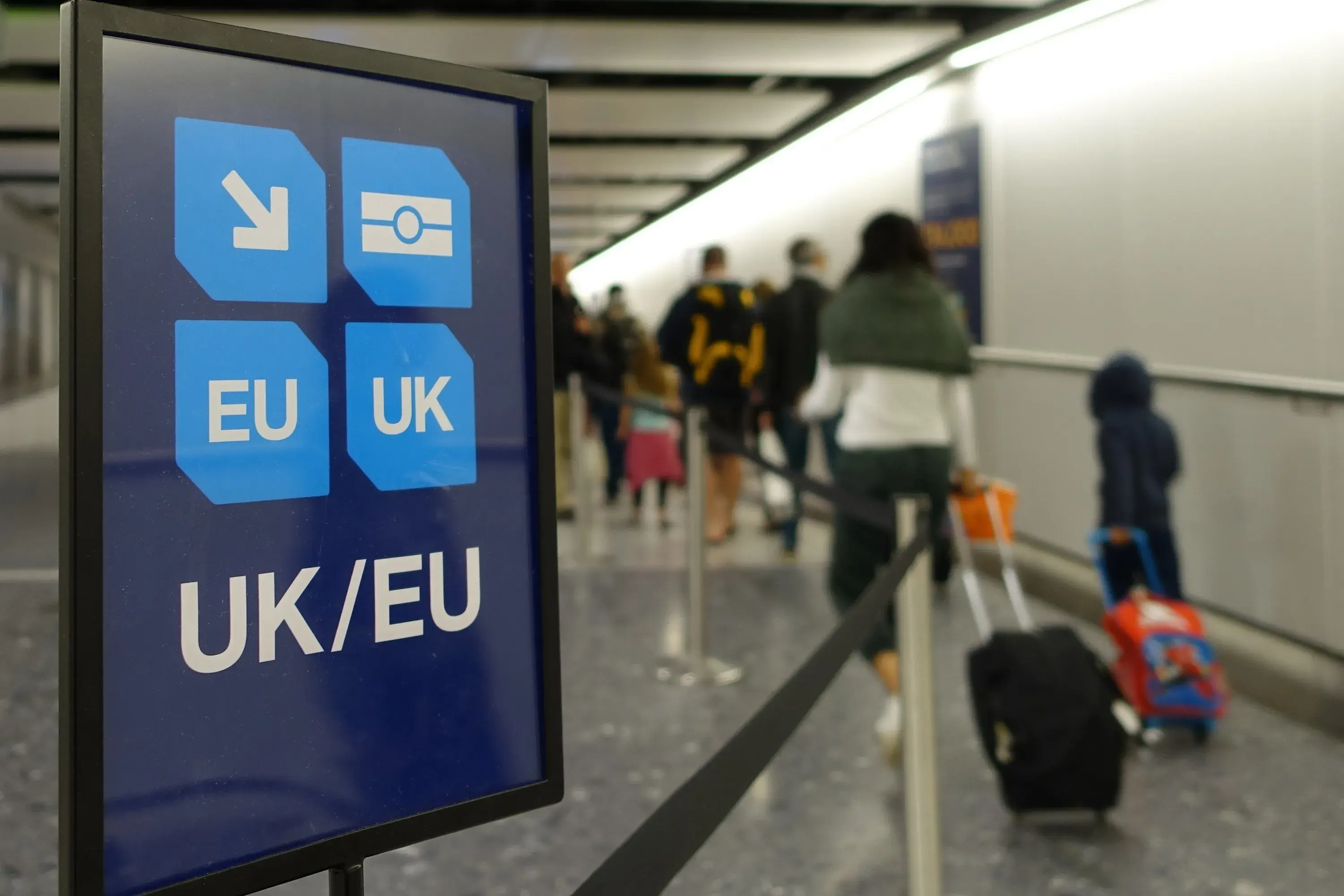 View of a generic UK and EU lane sign as air travellers proceed to border control at an airport View of a generic UK and EU lane sign as air travellers proceed to border control at an airport