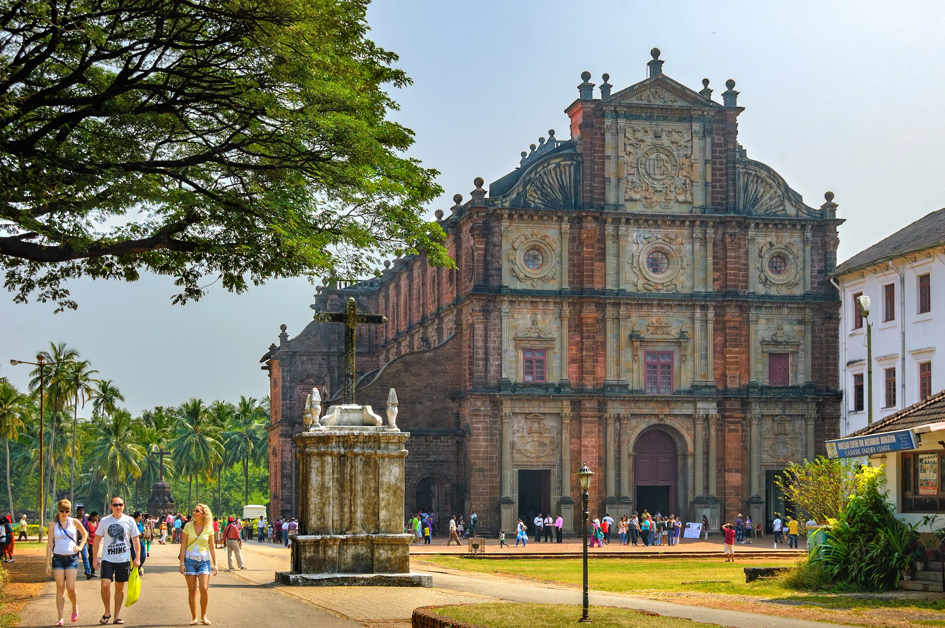 Old Goa, India - November 13, 2012: Unidentified tourists visit to the famous landmark - Basilica of Bom Jesus (Borea Jezuchi Bajilika) in Old Goa, India. Basilica is a UNESCO World Heritage Site.