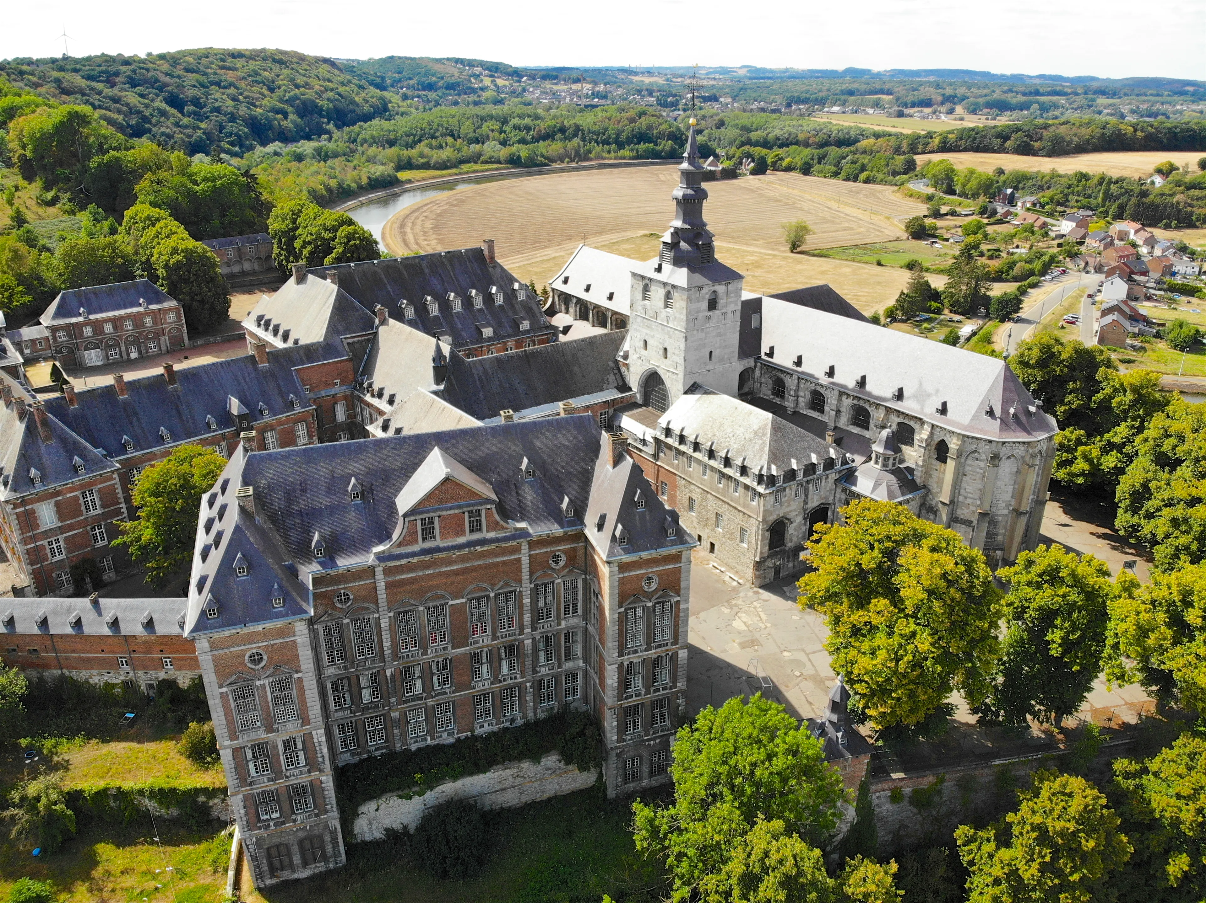 Aerial view of Floreffe Abbey during summer day, Belgium. Old abbey where they produced famous Floreffe beer. Top view green valley with beautiful abbey.