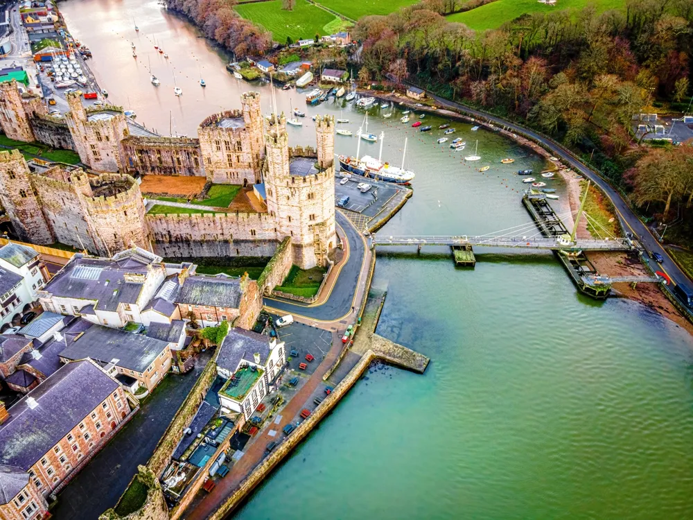 Aerial view of Caernarfon Castle, a medieval fortress in Caernarfon, Gwynedd, north-west Wales, UK