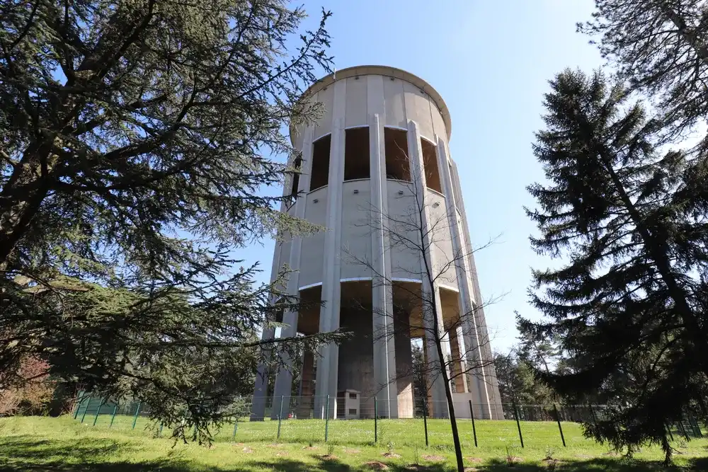 Bron, France - 03 27 2021 : The Bron water tower in the Parilly park, built in 1954, city of Bron, department of Rhône, France Bron, France - 03 27 2021 : The Bron water tower in the Parilly park, built in 1954, city of Bron, department of Rhône, France