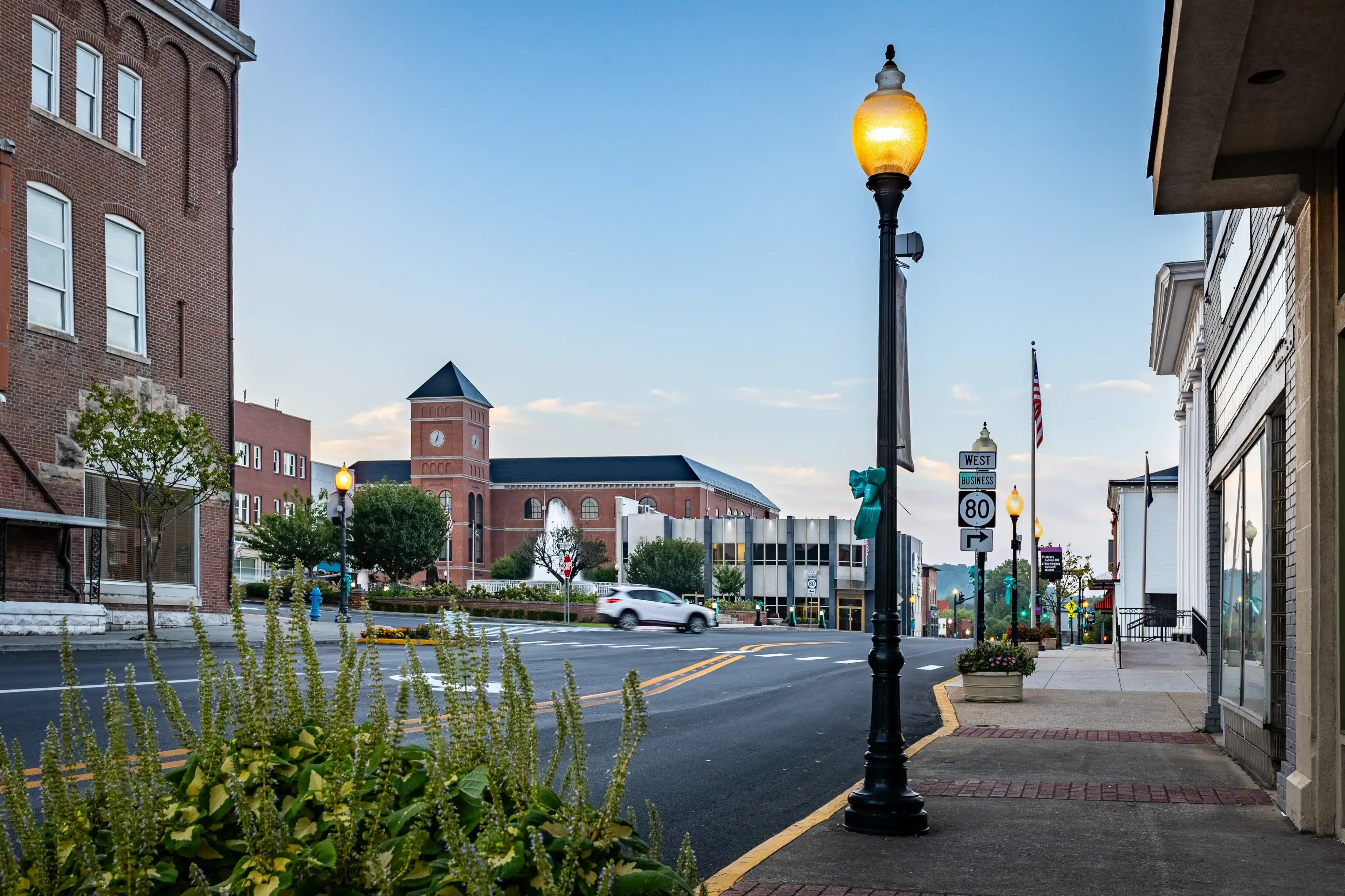 A car is turning on the roundabout around downtown fountain in a square in Somerset, Kentucky A car is turning on the roundabout around downtown fountain in a square in Somerset, Kentucky
