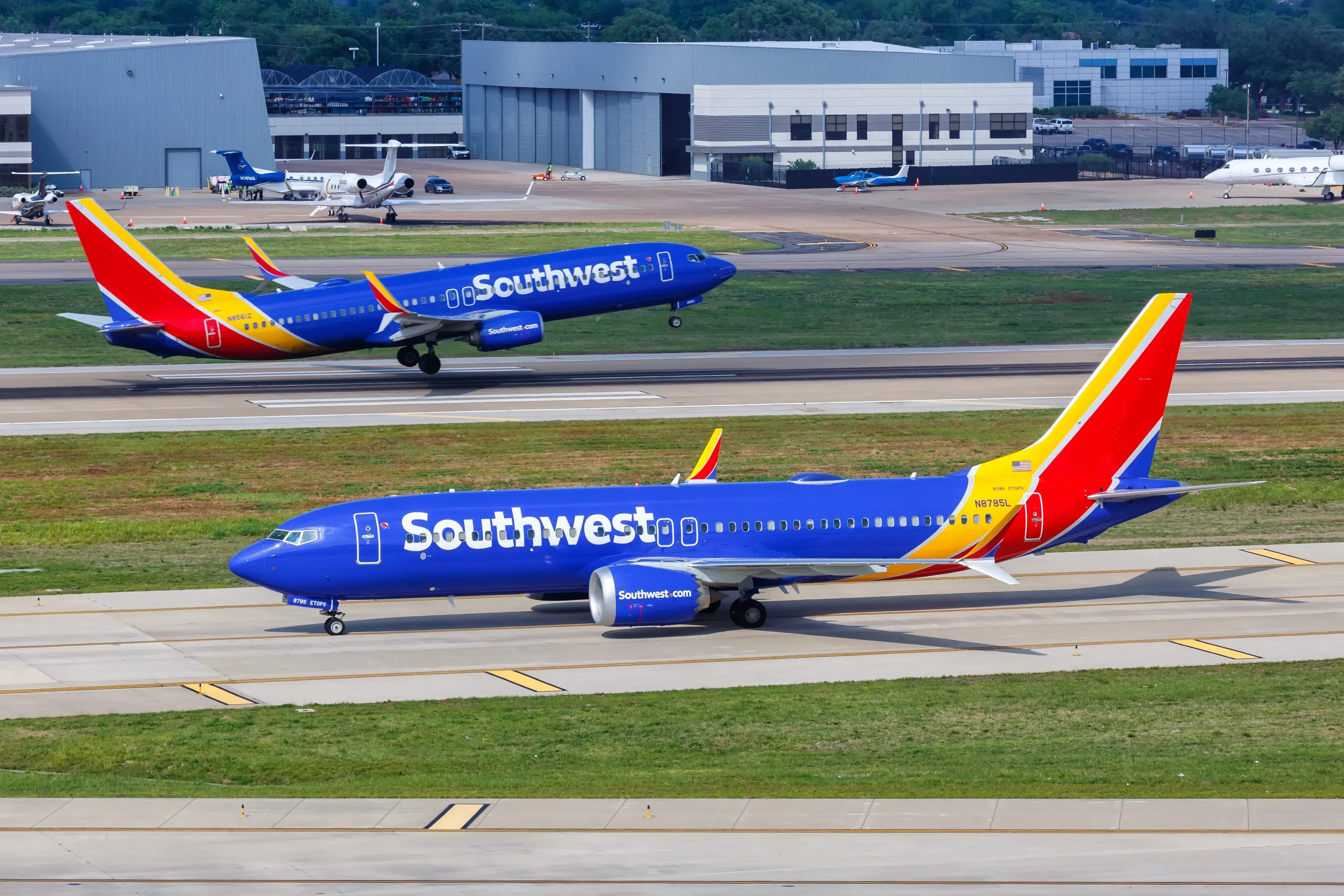 Dallas, United States - May 7, 2023: Southwest Boeing 737-8 MAX airplanes at Dallas Love Field Airport (DAL) in the United States. Dallas, United States - May 7, 2023: Southwest Boeing 737-8 MAX airplanes at Dallas Love Field Airport (DAL) in the United States.