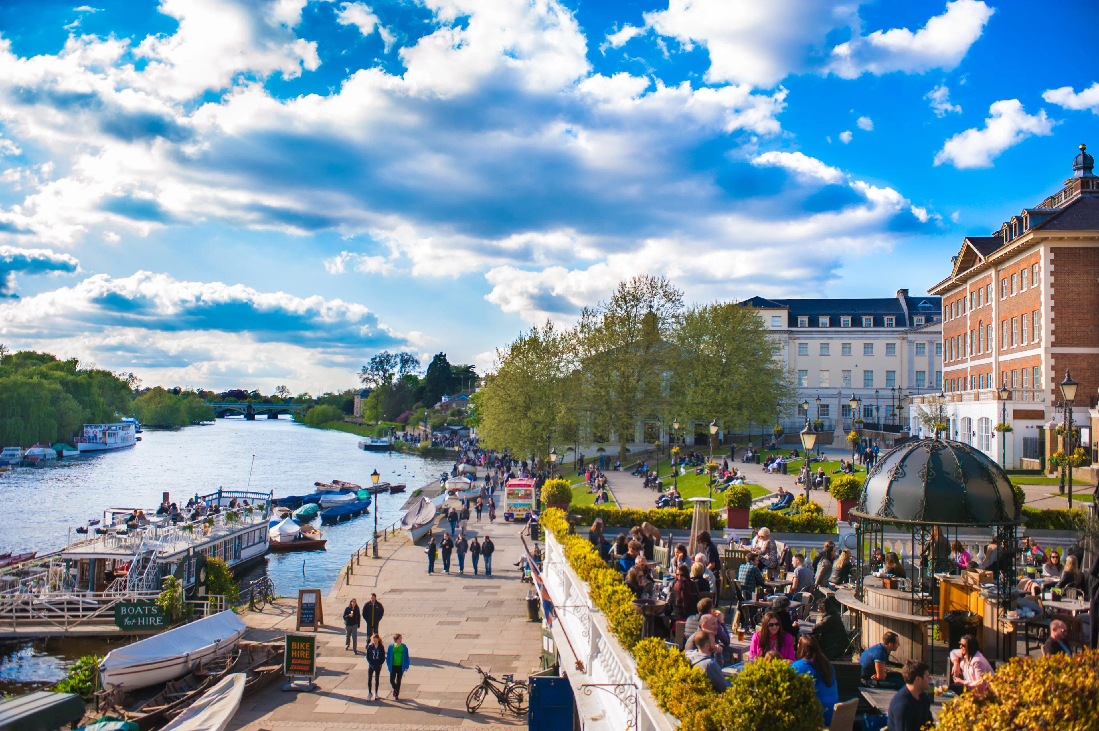 RICHMOND UPON THAMES, UK - APR 19: People enjoy the sunny weather in Richmond Upon Thames near London on April 19, 2014. The town is in proximity of a large number of parks, including Richmond Park