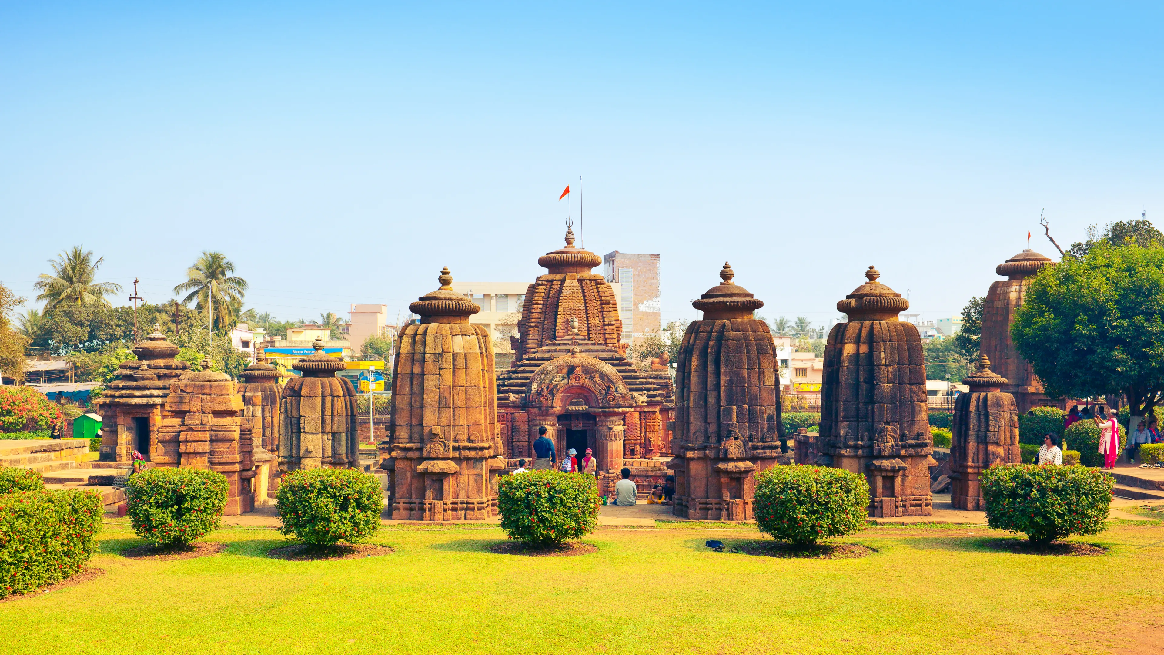 BHUBANESWAR, ODISHA / INDIA - JANUARY 20, 2019: Visitors studying beautyfull Mukteshvara Temple - 10th century hindu temple dedicated to Lord Shiva