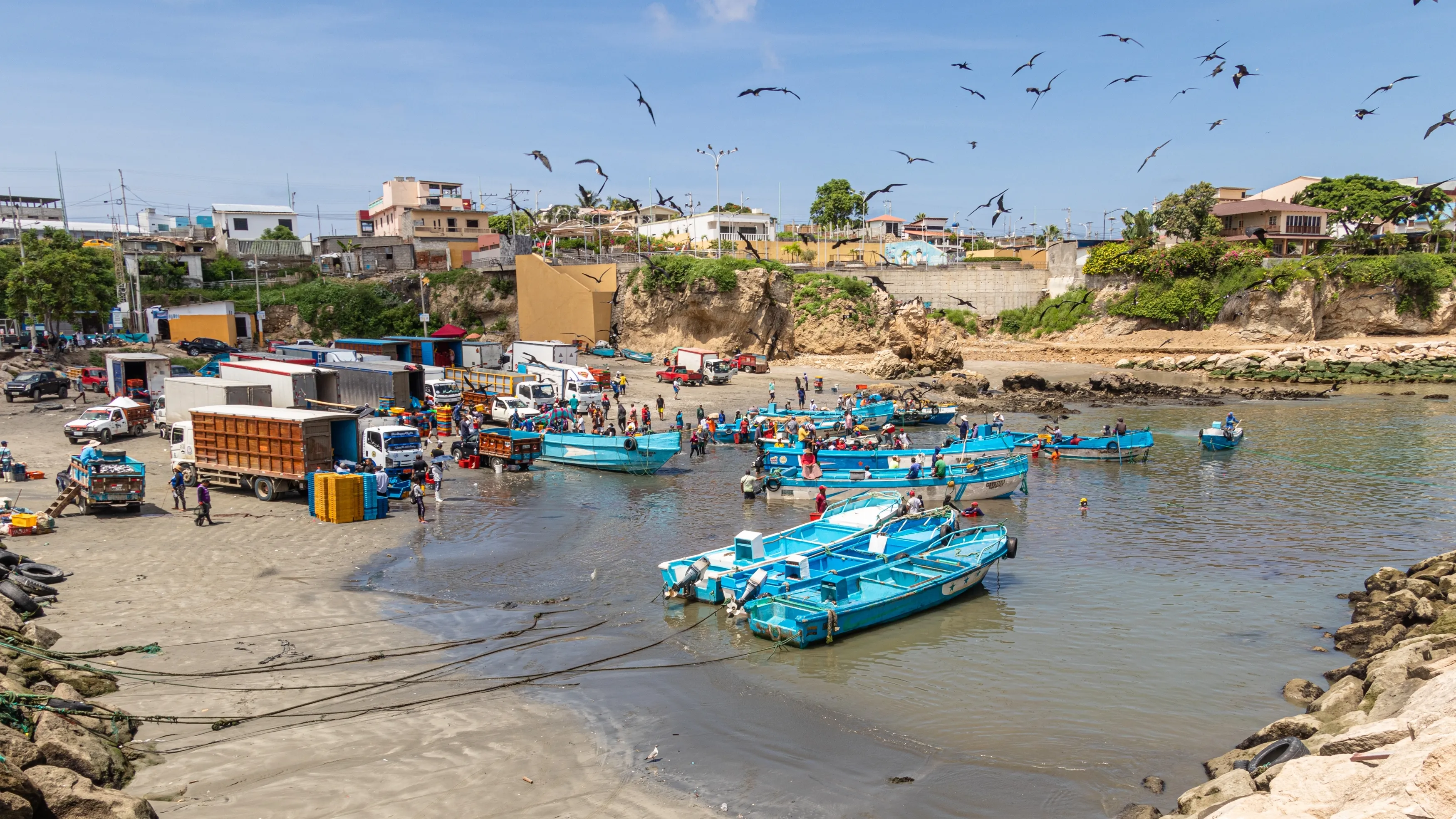 La Libertad, Ecuador - March 21, 2023: The port of La Libertad. Artisanal fishermen returning home after a night catching fish at ocean and sell their product. Ecuador, Santa Elena province