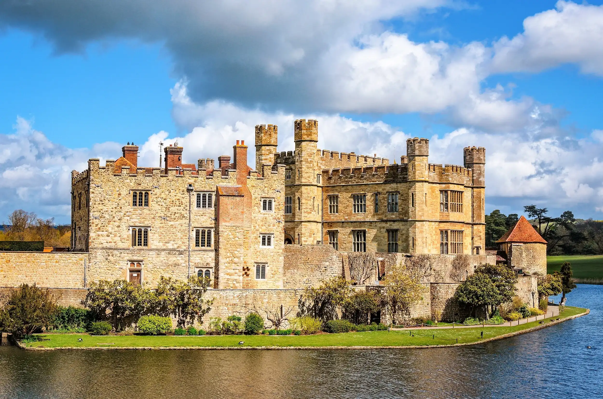 Maidstone, United Kingdom - April 27, 2012: Main building of Leeds Castle with surrounding moat. Maidstone, United Kingdom - April 27, 2012: Main building of Leeds Castle with surrounding moat.