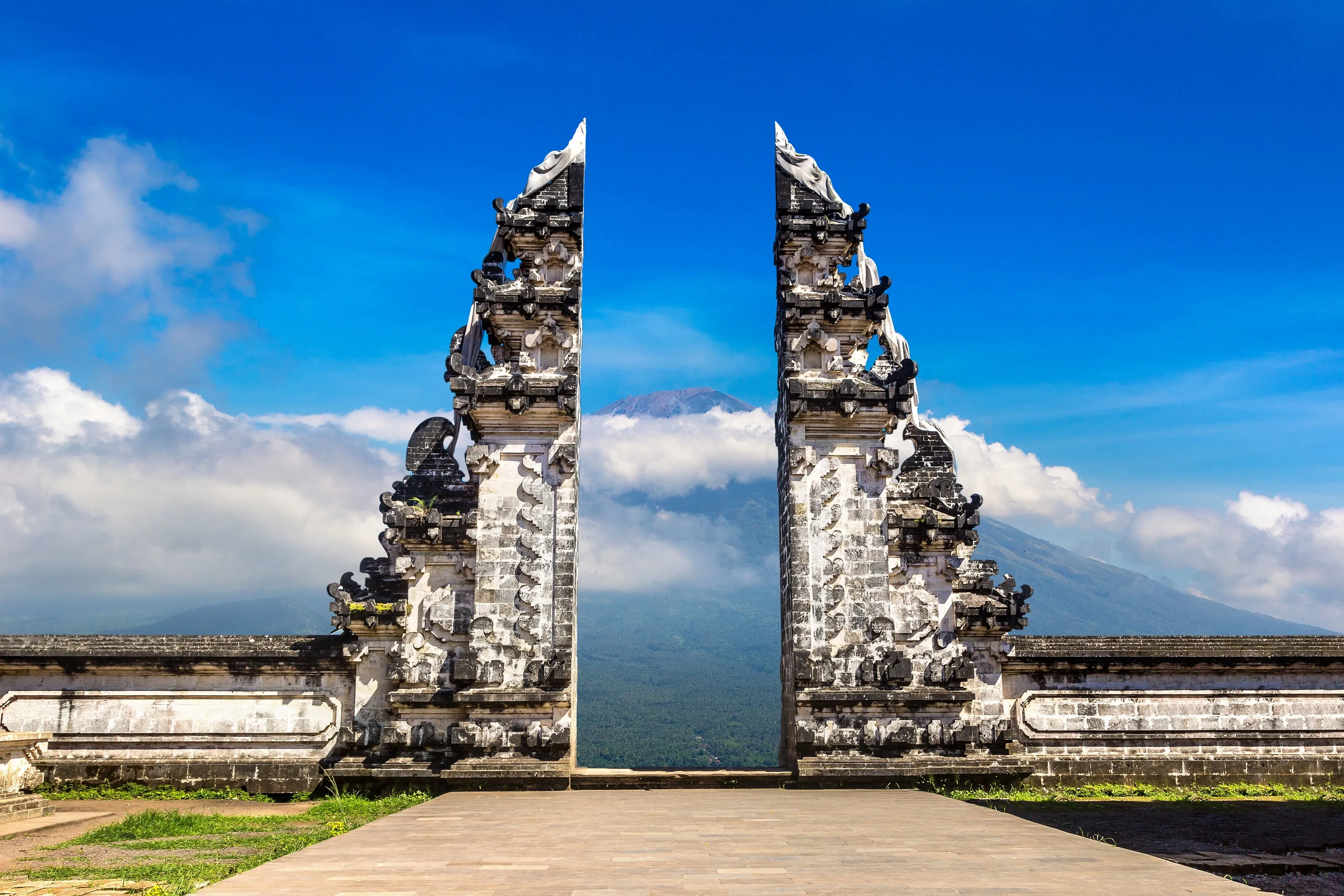 Ancient gate at Pura Penataran Agung Lempuyang temple and volcano Agung on Bali, Indonesia in a sunny day