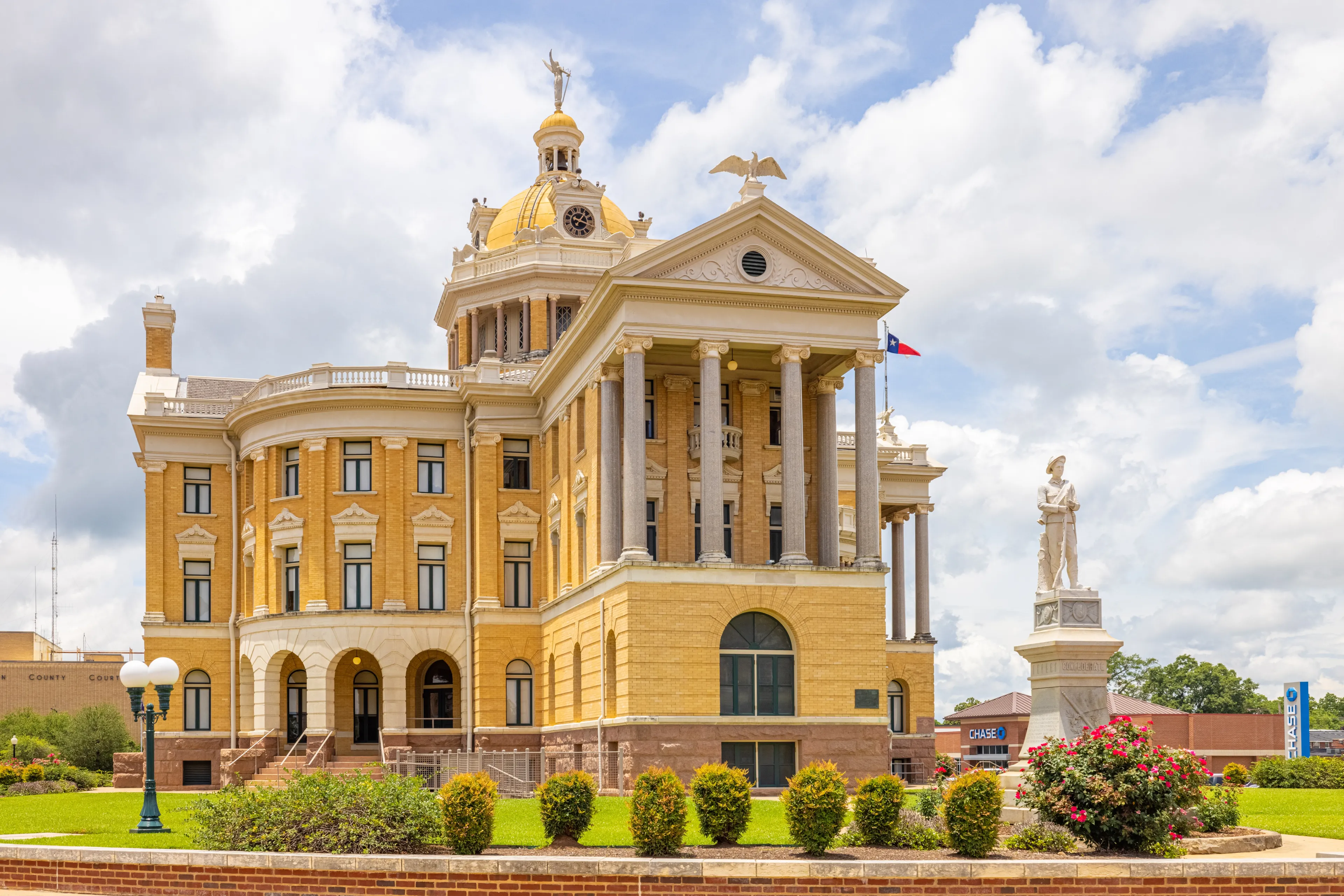 Marshall, Texas, USA - June 28, 2021: The Harrison County Courthouse and its confederate memorial