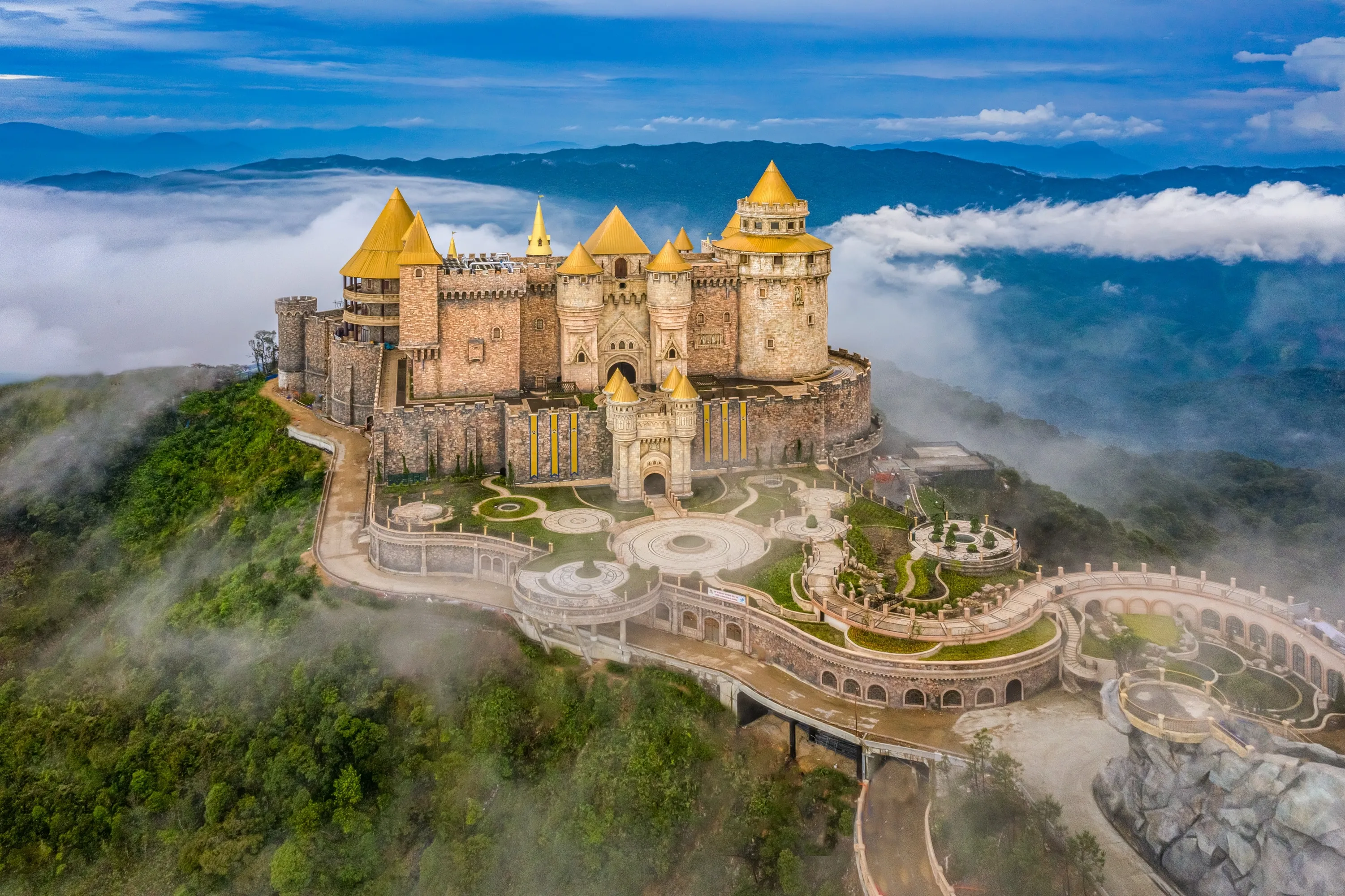 Aerial view of landscape is lunar castles covered with fog at the top of Bana Hills, the famous tourist destination of Da Nang, Vietnam. Near Golden bridge. Panorama