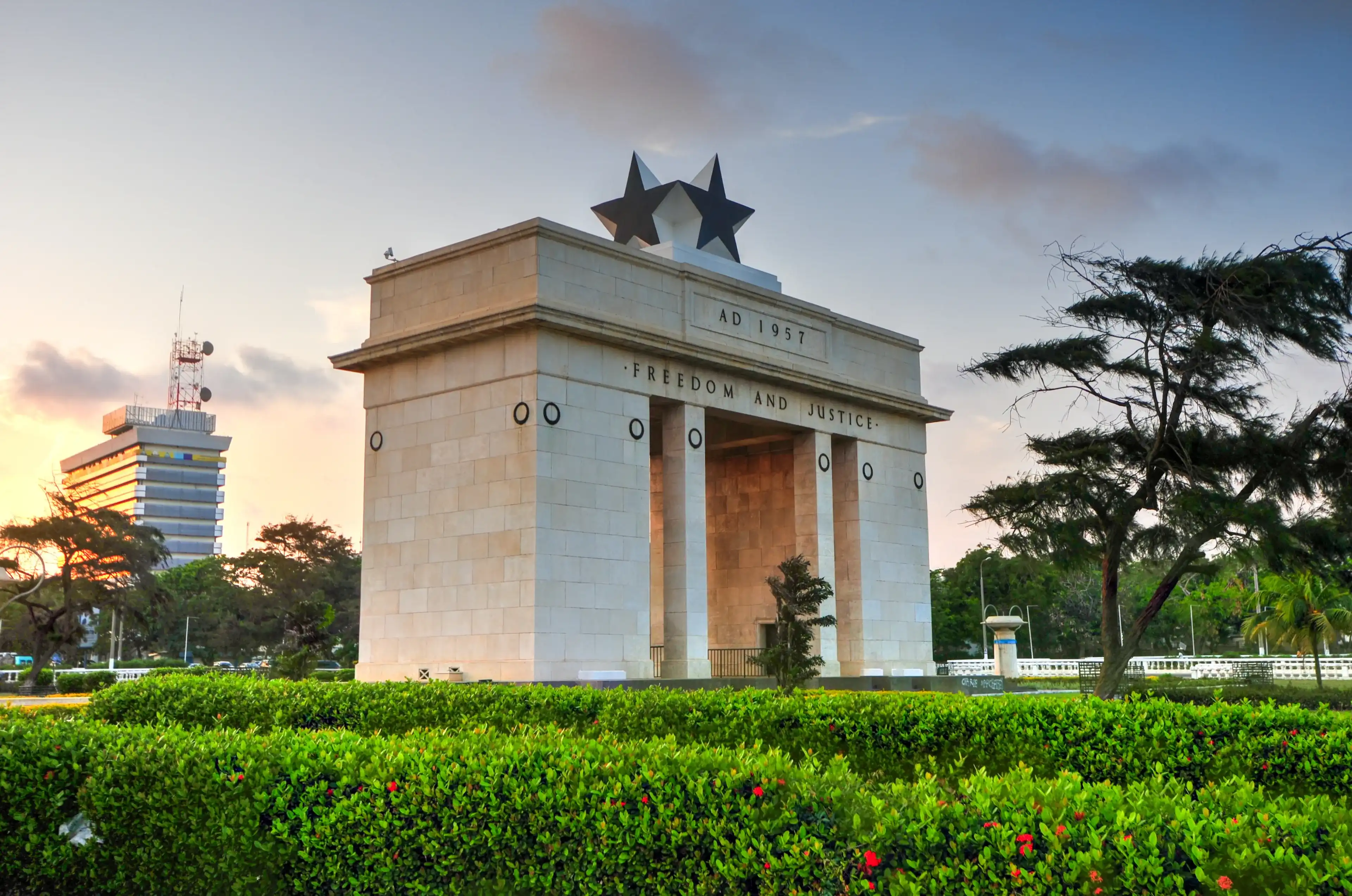 ACCRA, GHANA - NOVEMBER 14, 2011: The Independence Arch of Independence Square of Accra at sunset. Inscribed with the words "Freedom and Justice, AD 1957", commemorates the independence of Ghana. ACCRA, GHANA - NOVEMBER 14, 2011: The Independence Arch of Independence Square of Accra at sunset. Inscribed with the words "Freedom and Justice, AD 1957", commemorates the independence of Ghana.