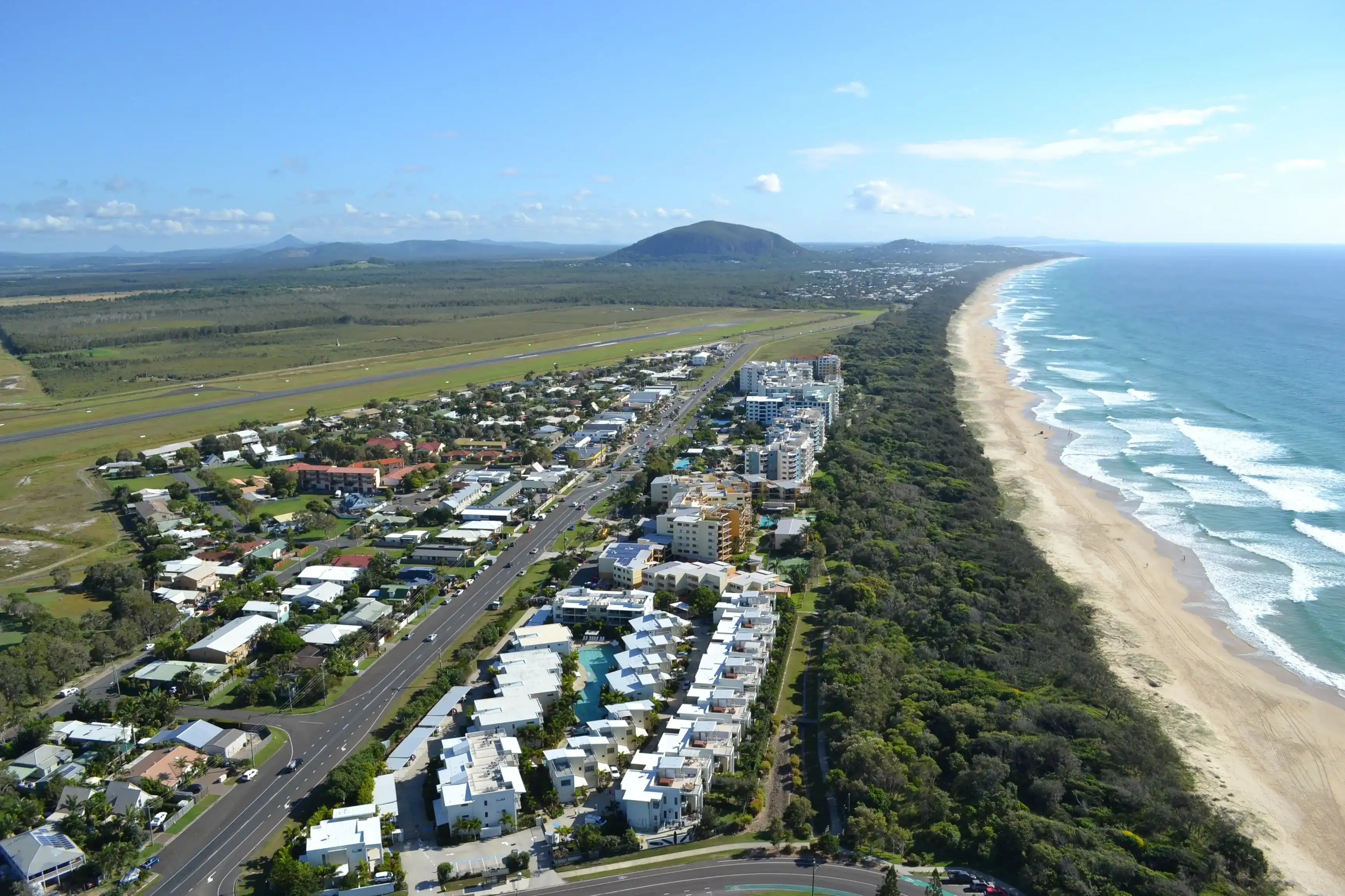 Aerial view north along Marcoola and the beach towards Mount Coolum, Sunshine Coast, Australia in 2016 Aerial view north along Marcoola and the beach towards Mount Coolum, Sunshine Coast, Australia in 2016