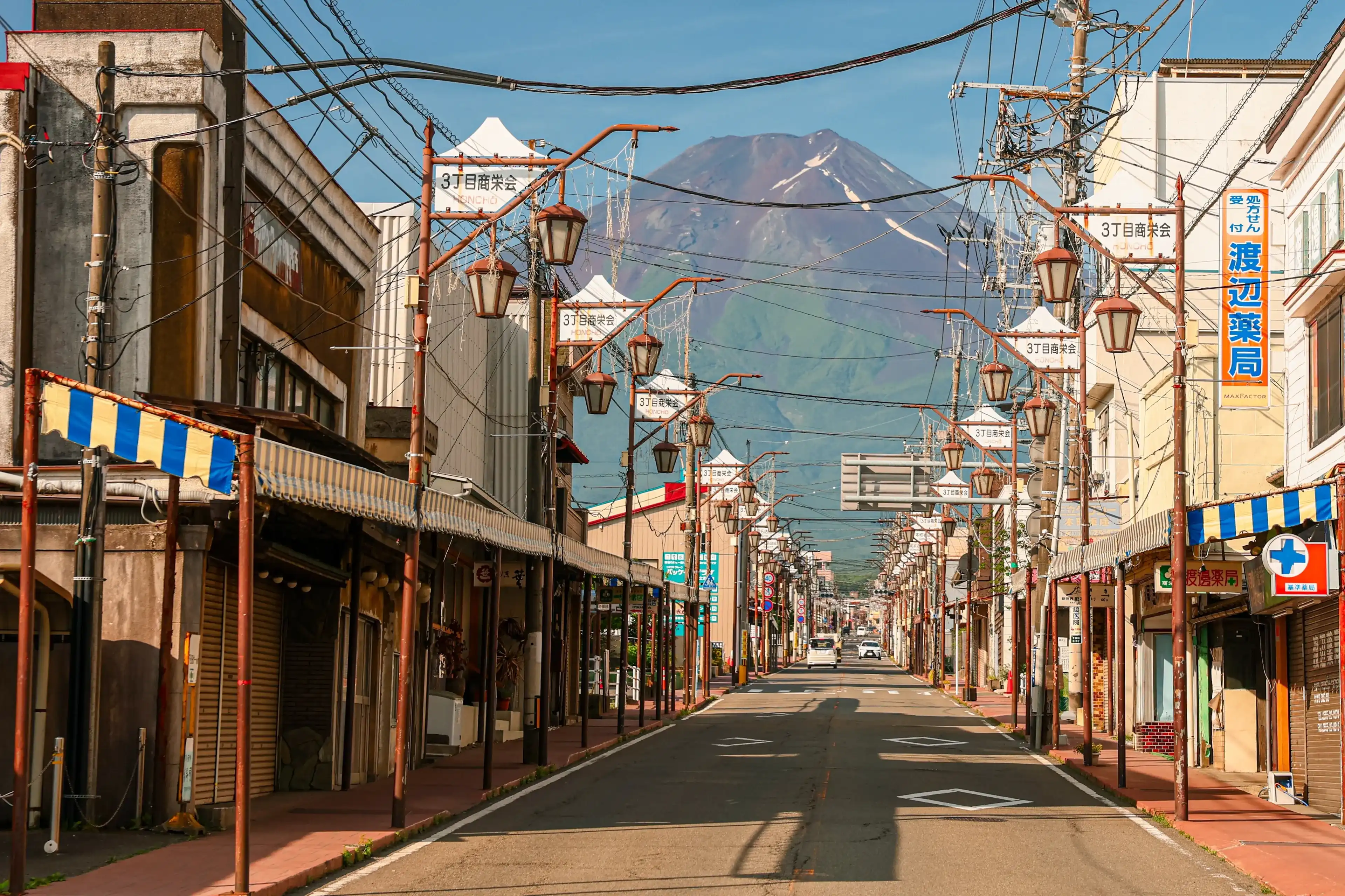 Shimoyoshida, Fujiyoshida, JAPAN - June 21, 2025: Mount Fuji can be seen Seen from Honcho Street on a Clear Morning with blue skies. Shimoyoshida, Fujiyoshida, JAPAN - June 21, 2025: Mount Fuji can be seen Seen from Honcho Street on a Clear Morning with blue skies.