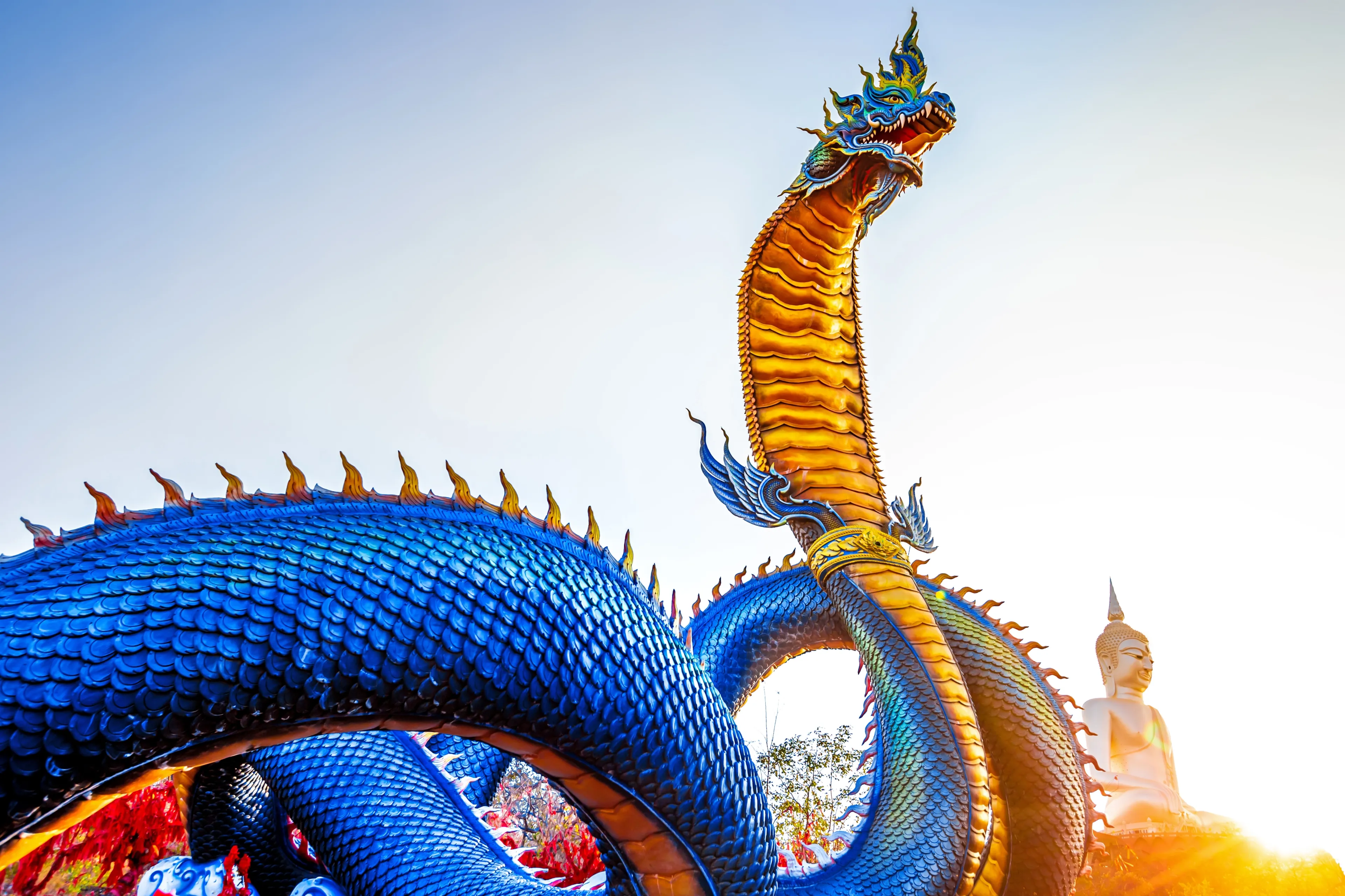 Phaya Si Mukda Maha Muni Nilapala Nakharat Giant Naga statue stands at the center of the temple Wat Roi Phra Phutthabat Phu Manorom, is situated on Phu Manorom, a small mountain in,Mukdahan,Thailand
