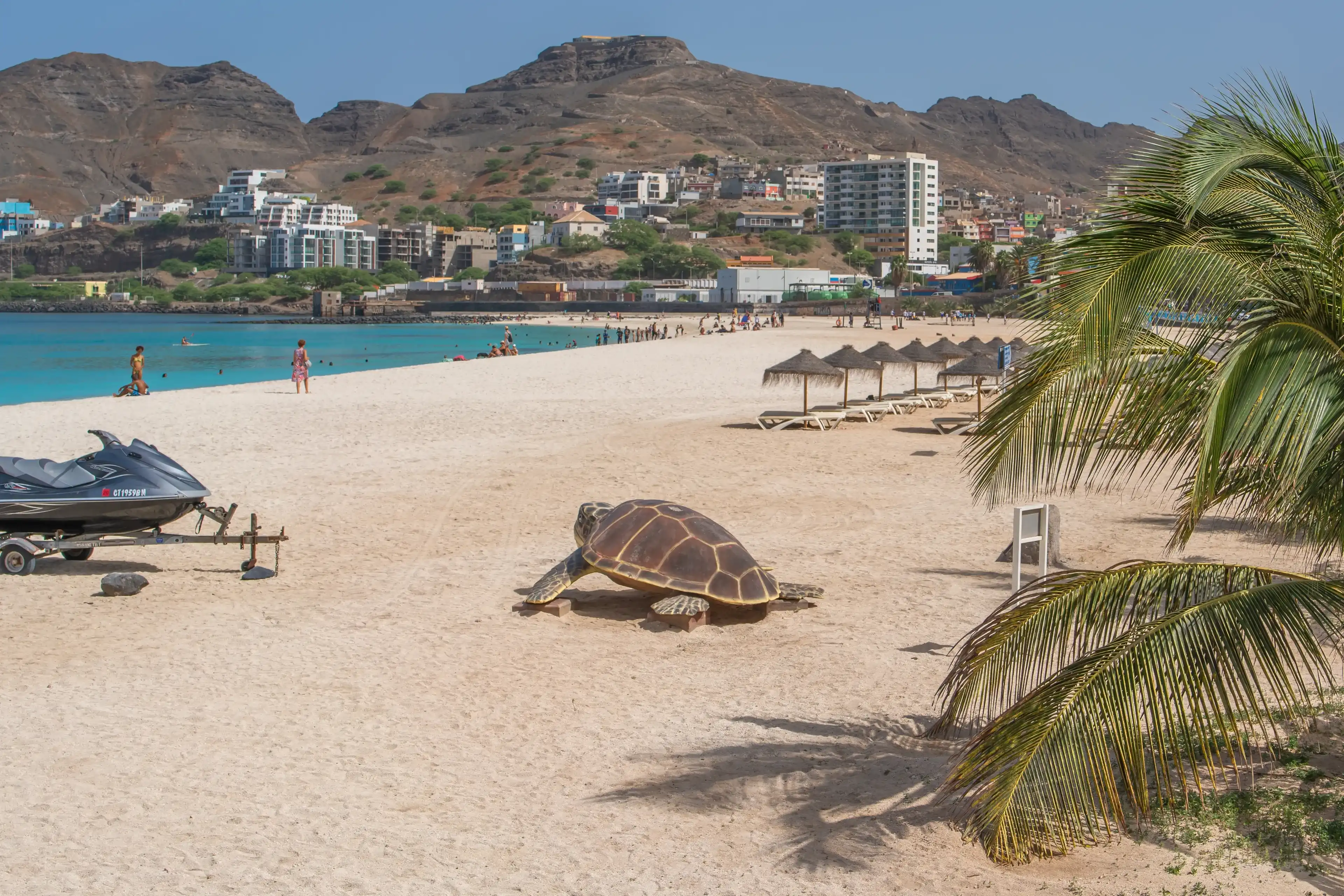 Mindelo, Sao Vicente Island, Cape Verde - October 07.2023: Turquoise Laginha beach with white sand and a turtle sculpture in Mindelo city Mindelo, Sao Vicente Island, Cape Verde - October 07.2023: Turquoise Laginha beach with white sand and a turtle sculpture in Mindelo city