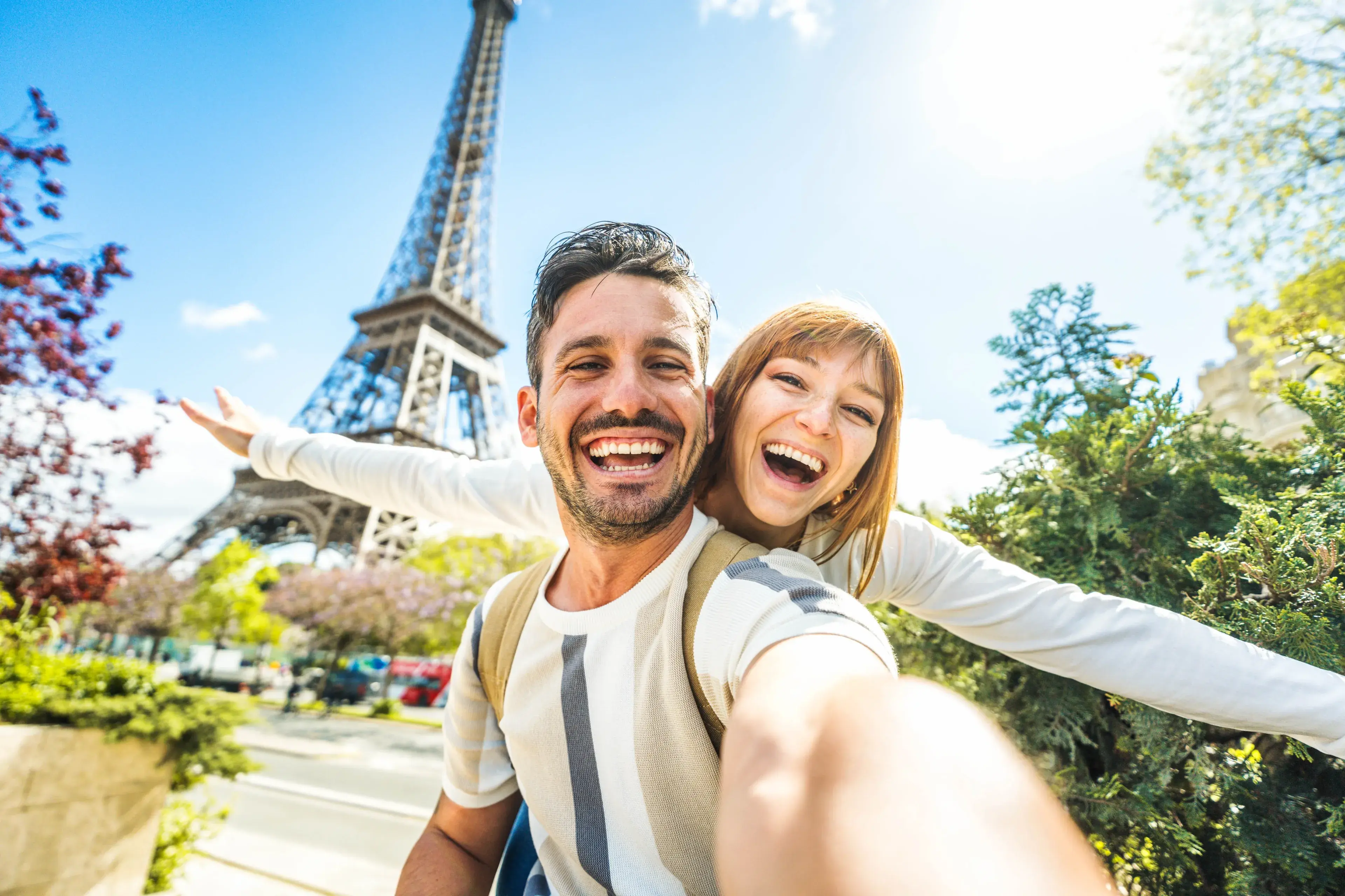 Happy couple of tourists taking selfie picture in front of Eiffel Tower in Paris, France - Travel and summer vacation life style concept Happy couple of tourists taking selfie picture in front of Eiffel Tower in Paris, France - Travel and summer vacation life style concept