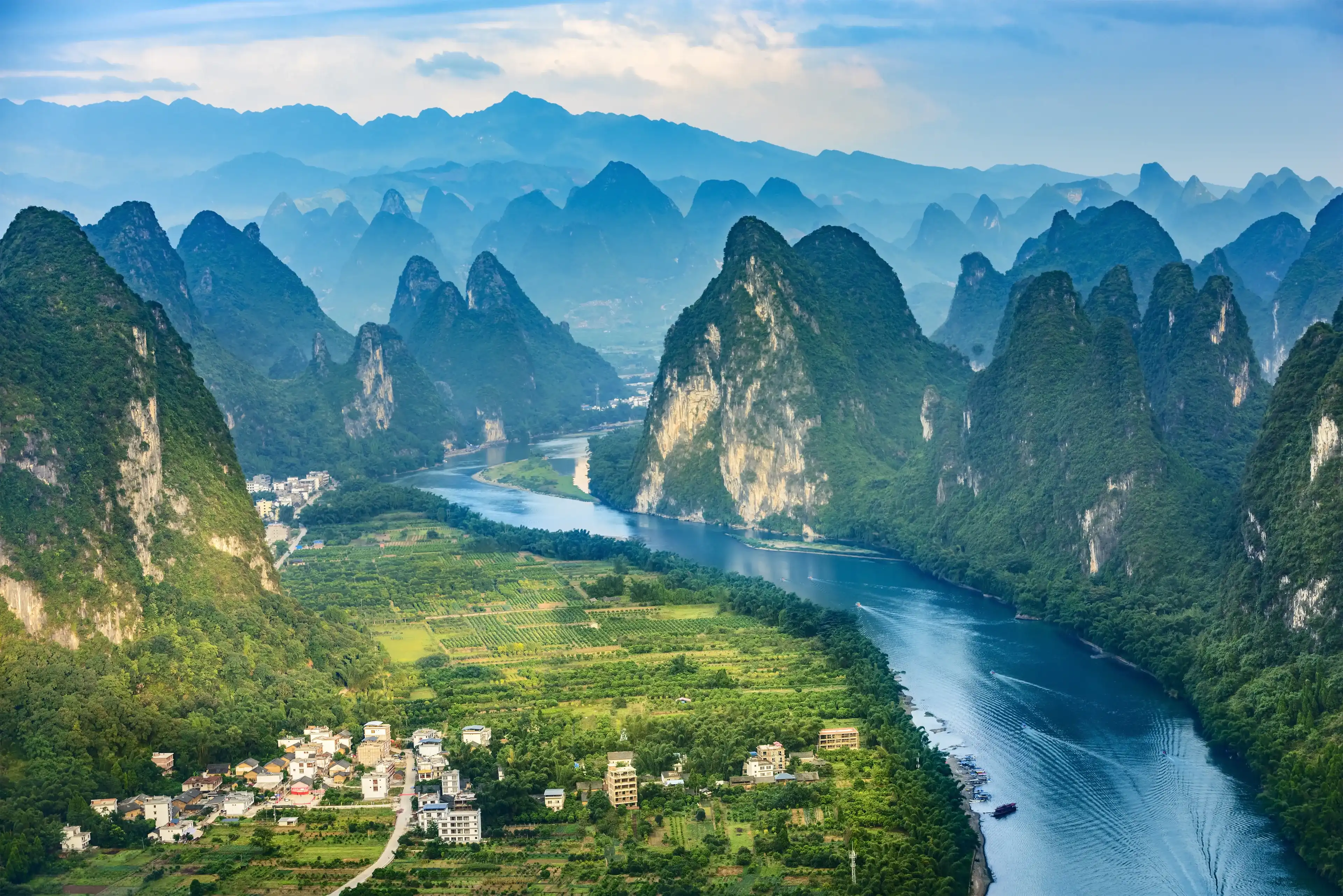 Landscape of Guilin, Li River and Karst mountains. Located near The Ancient Town of Xingping, Yangshuo County, Guangxi Province, China. Landscape of Guilin, Li River and Karst mountains. Located near The Ancient Town of Xingping, Yangshuo County, Guangxi Province, China.