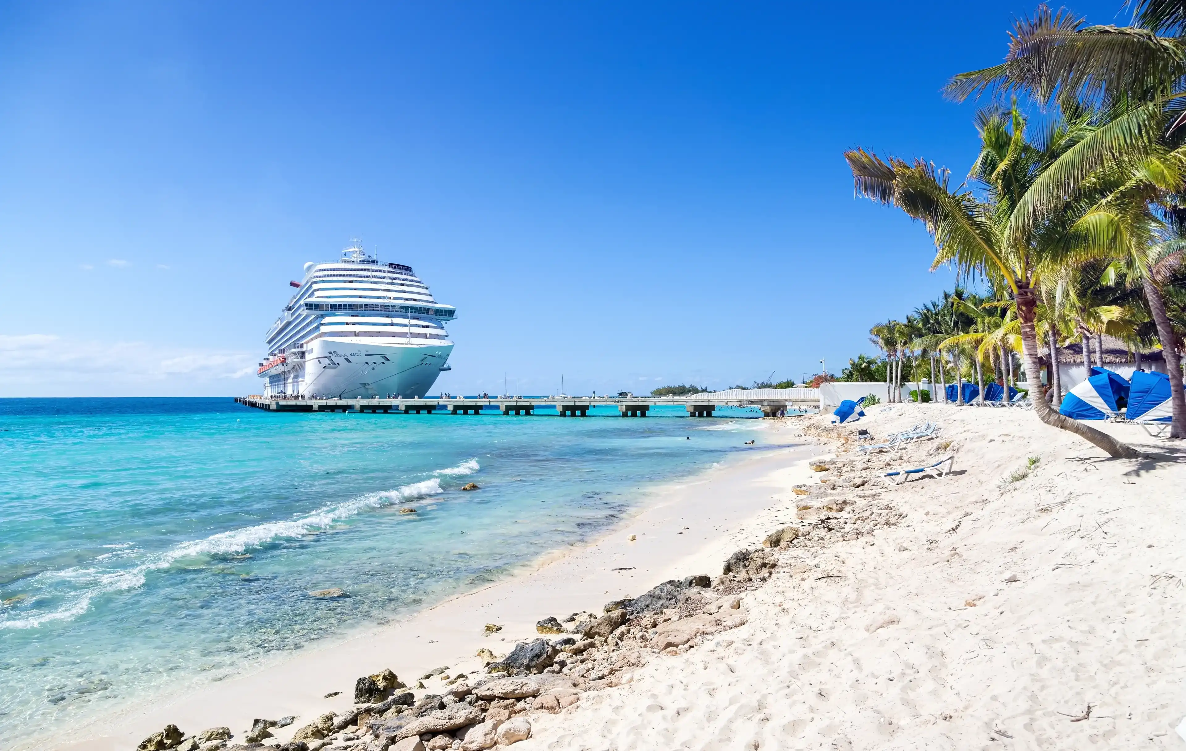 Grand Turk, Turks and Caicos Islands - MARCH 29, 2019: Cruise ship Carnival Magic docked at port Grand Turk on sunny day Grand Turk, Turks and Caicos Islands - MARCH 29, 2019: Cruise ship Carnival Magic docked at port Grand Turk on sunny day