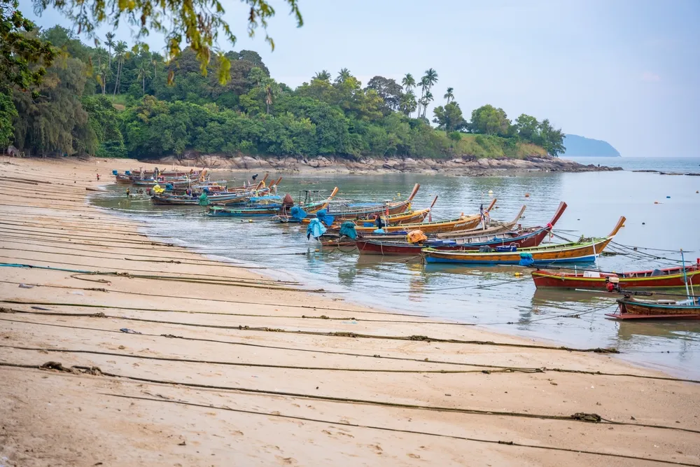 Rawai, Thailand - December 12, 2023: Fishing boats at Rawai beach after day work in Thailand. High quality photo