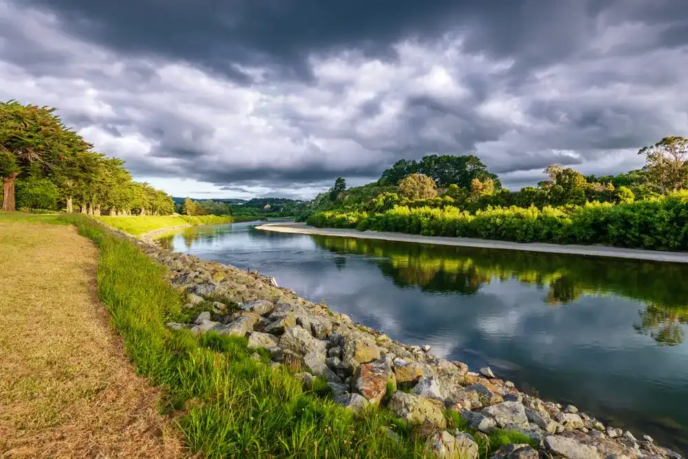 On the banks of the river Manawatu in Palmerston North New Zealand under dramatic skies On the banks of the river Manawatu in Palmerston North New Zealand under dramatic skies