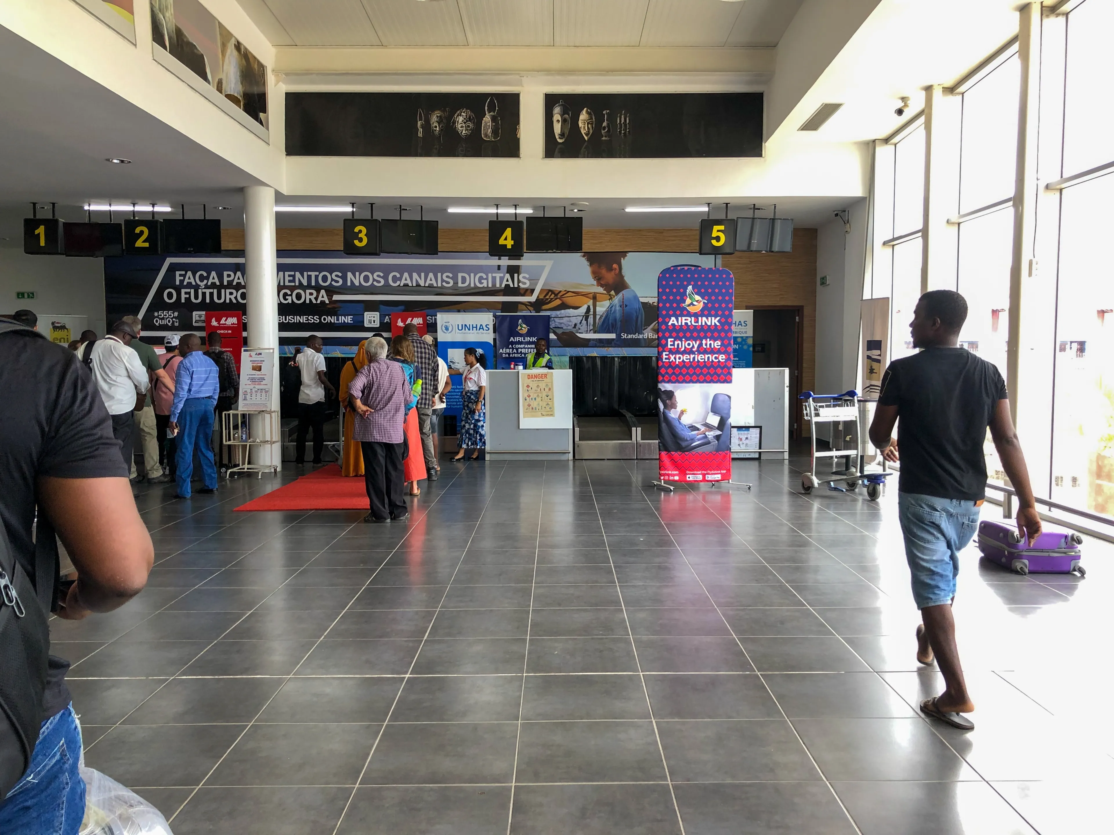 Pemba, Mozambique - March 08th 2023: Passengers during check-in at airport in Pemba(POL), Cabo Delgado province.