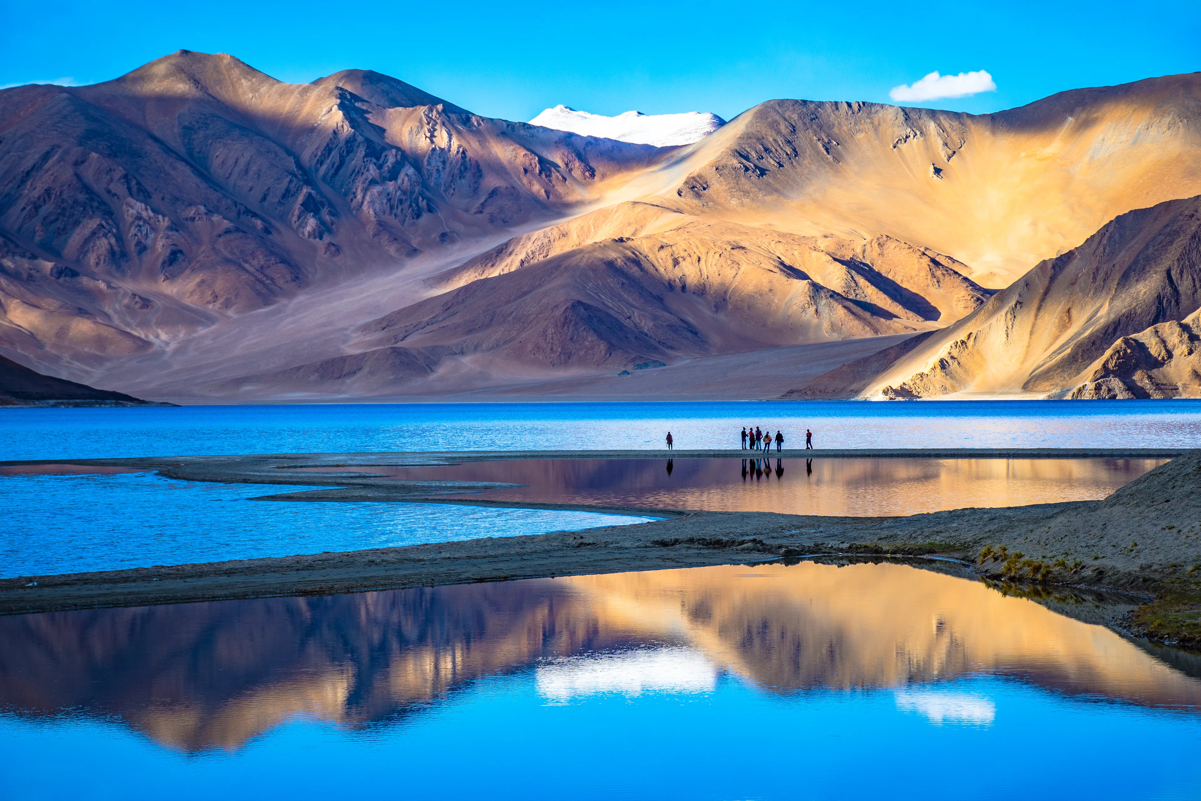 Leh, Ladakh, India-June 8 2017: Landscape with reflections of the mountains on the lake named Pagong Tso, situated on the border with India and China.
